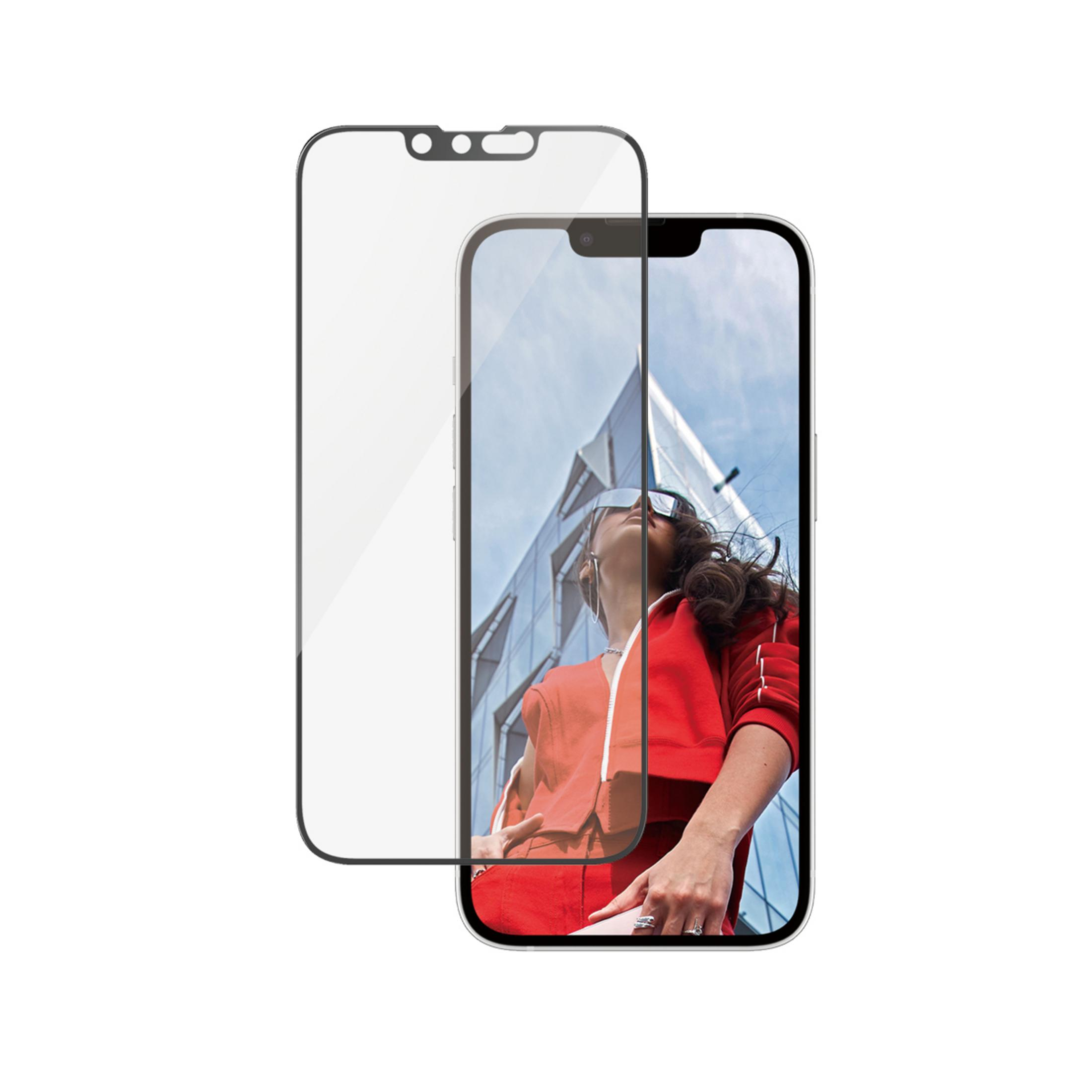 Ochraniacz ekranu i smartfon z kobietą w czerwonym stroju przed budynkiem.