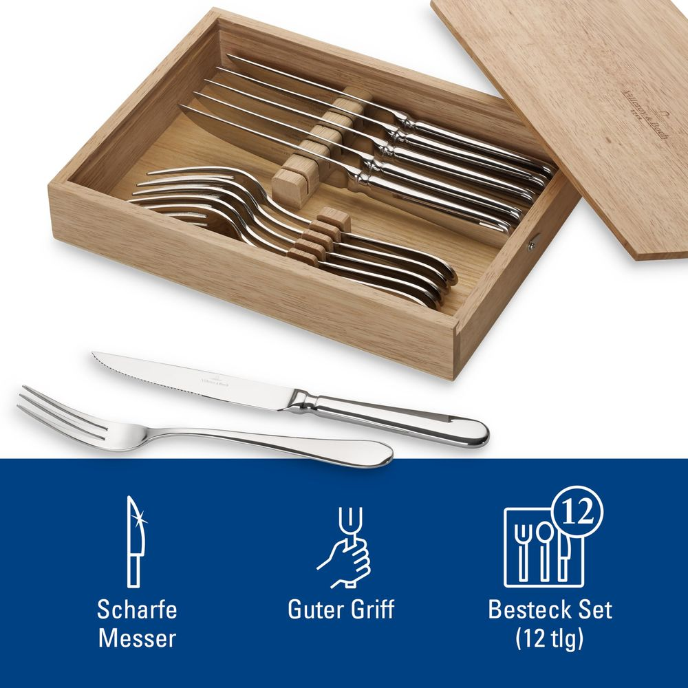 Ein Holzkasten mit silbernen Besteckteilen, Gabeln und Messern.