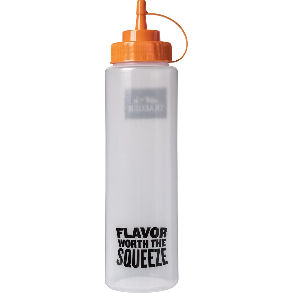 Eine durchsichtige Quetschflasche mit orangefarbenem Deckel und Aufsatz.
