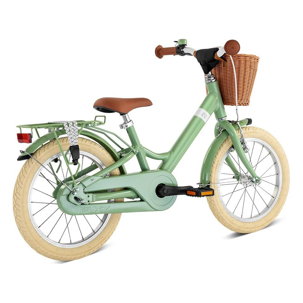 Un vélo enfant vert clair avec selle, guidon et panier marron.