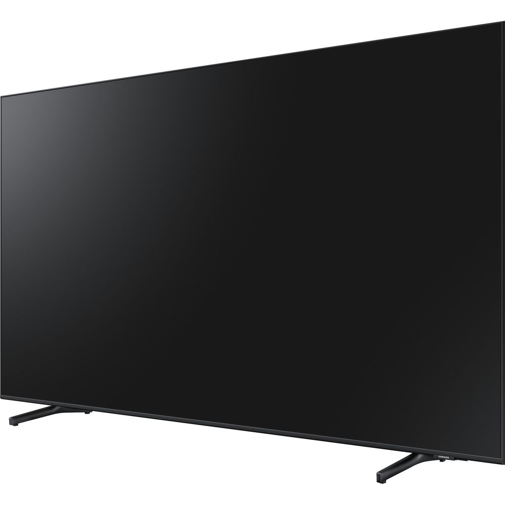 Une grande télévision noire à cadre fin repose sur un pied.