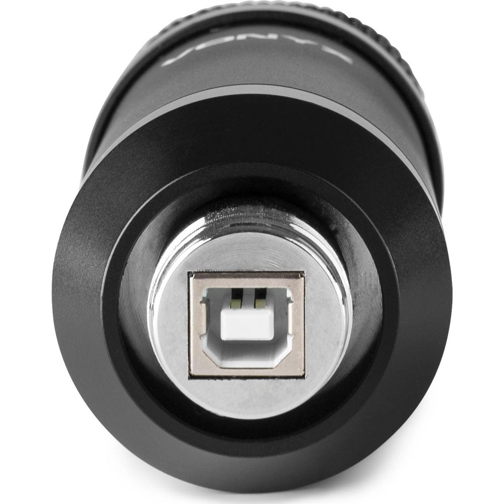 Een zwart cilindrisch object met een USB-poort aan de voorkant.
