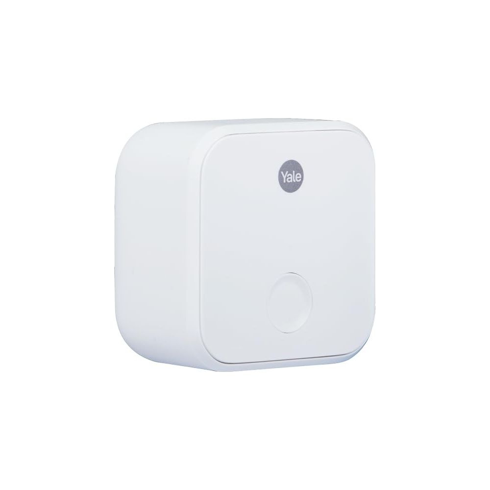 Un dispositivo bianco per la smart home Yale con pulsante e logo circolari.