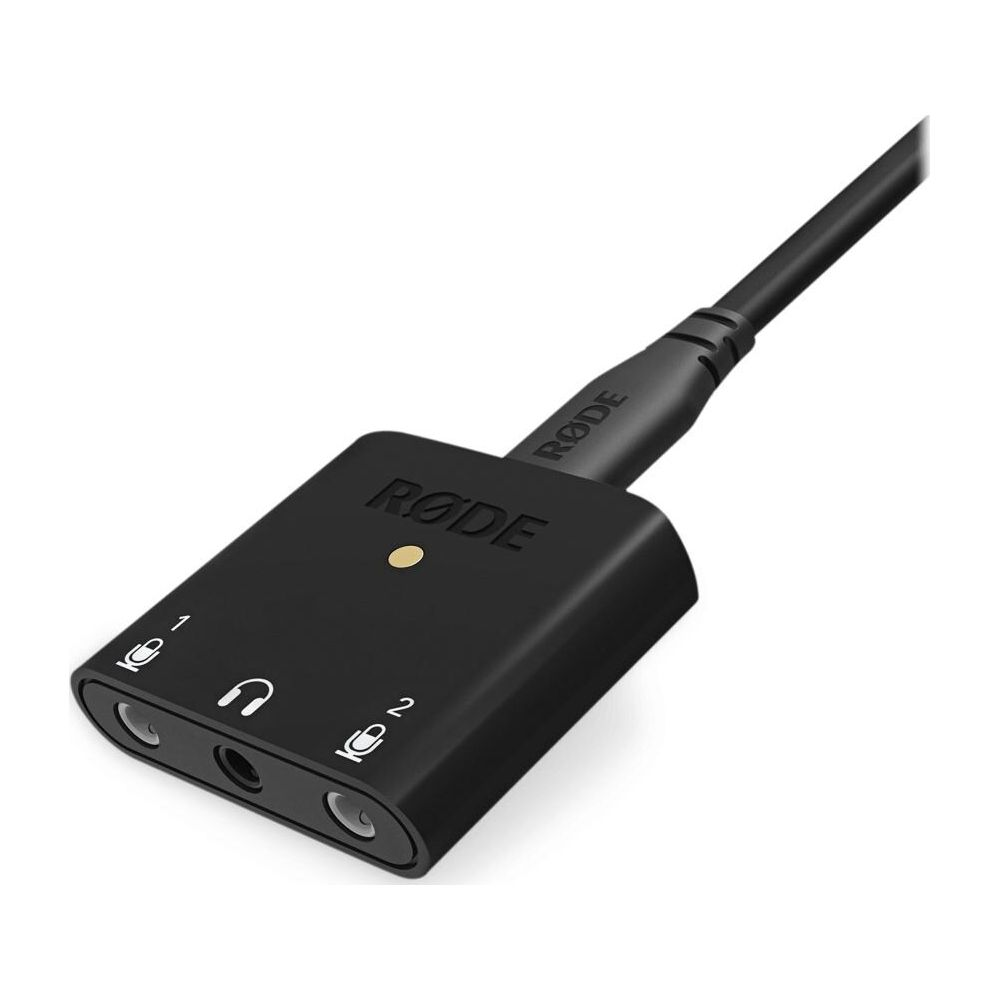 Een zwarte RØDE adapter met kabel, gelabeld met microfoon- en hoofdtelefooniconen.