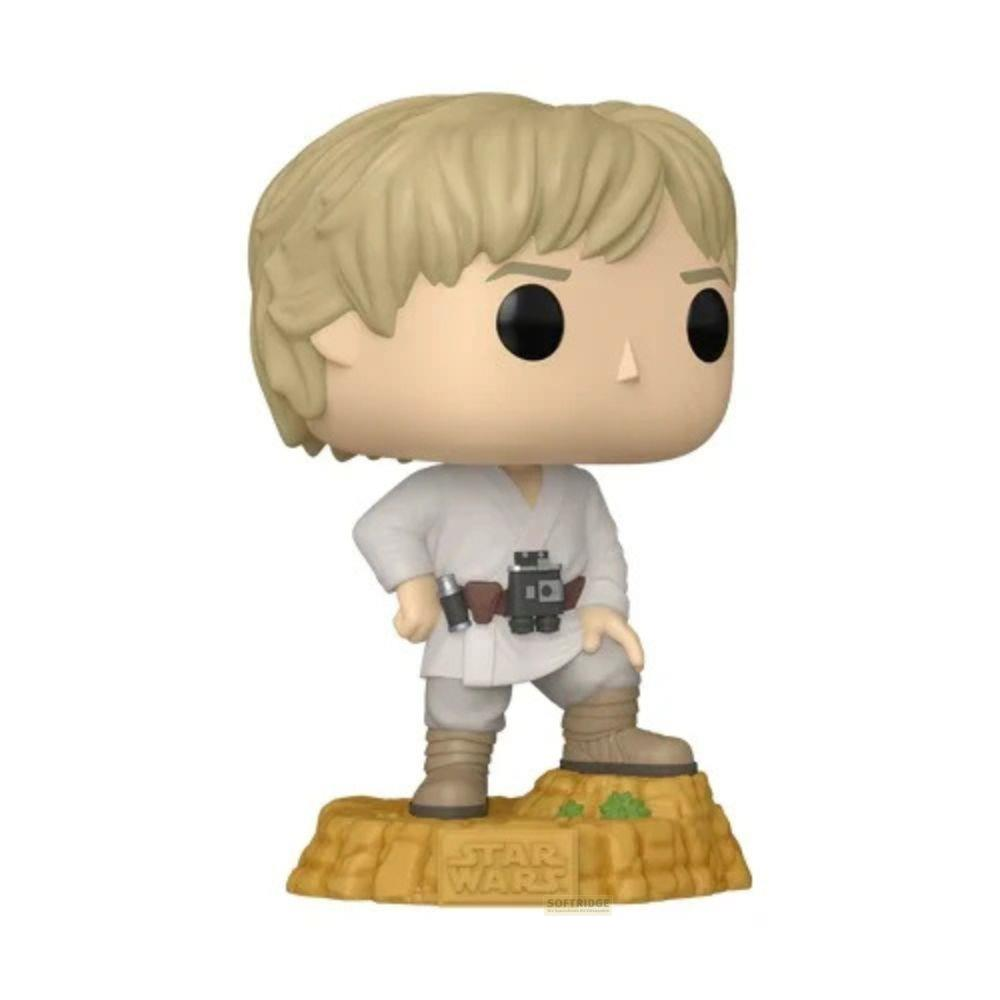 Figurka Funko Pop! Luke'a Skywalkera w białym stroju na skalistej podstawie.