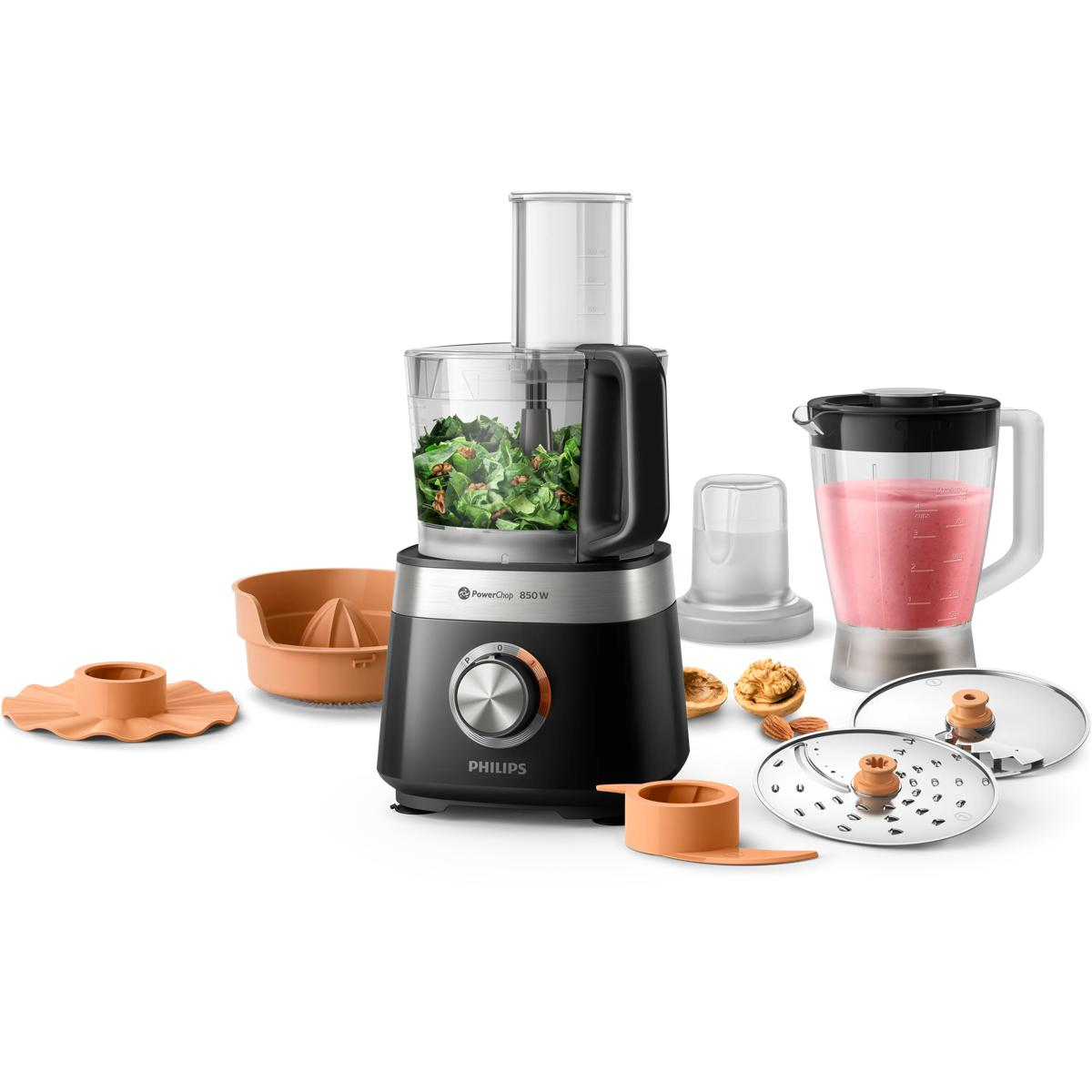 Ein Küchenmaschinen-Set mit schwarzem Sockel, gefülltem Behälter, Mixer und Zubehör.