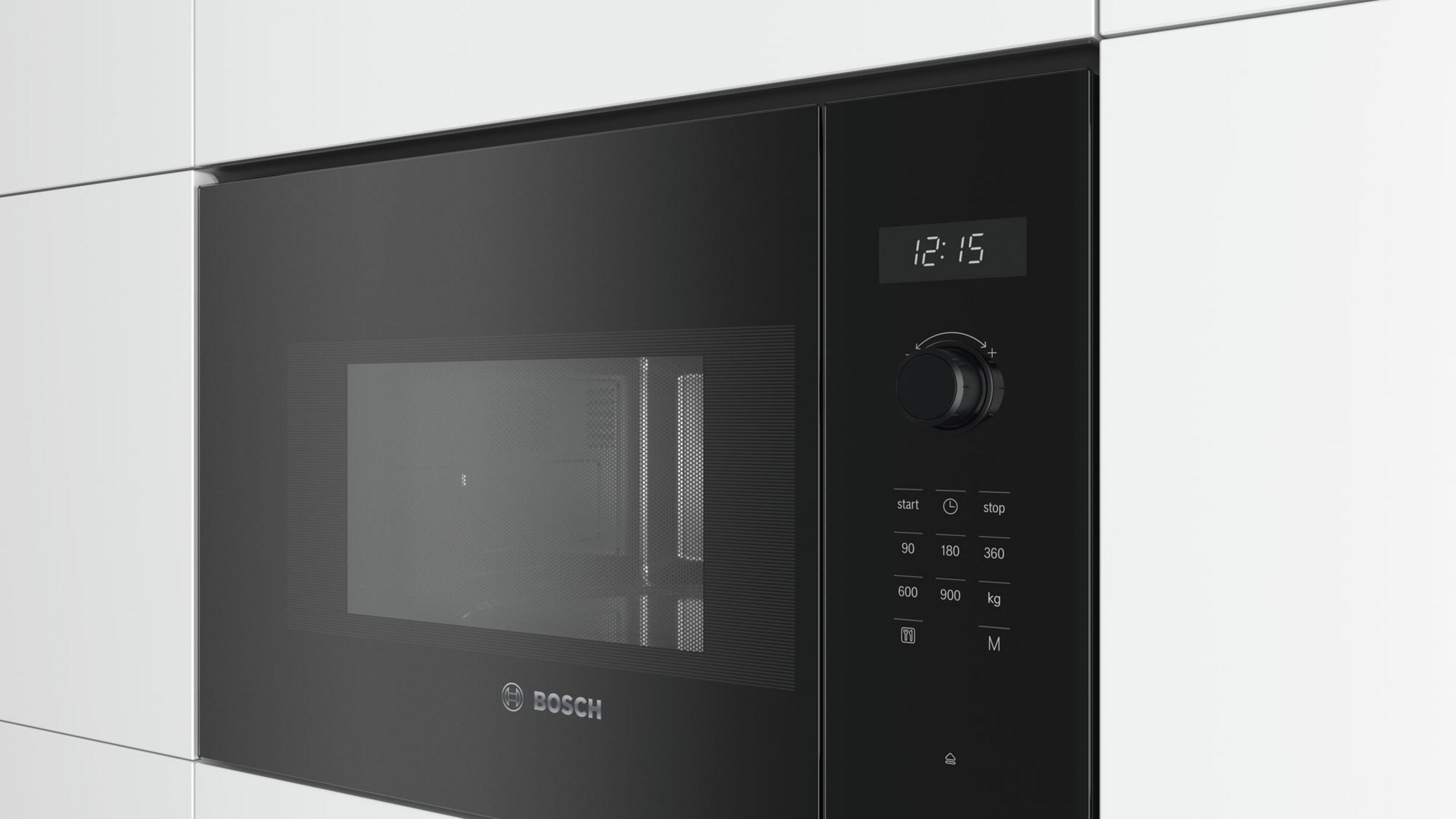 Black microwave with digital display and control knob.