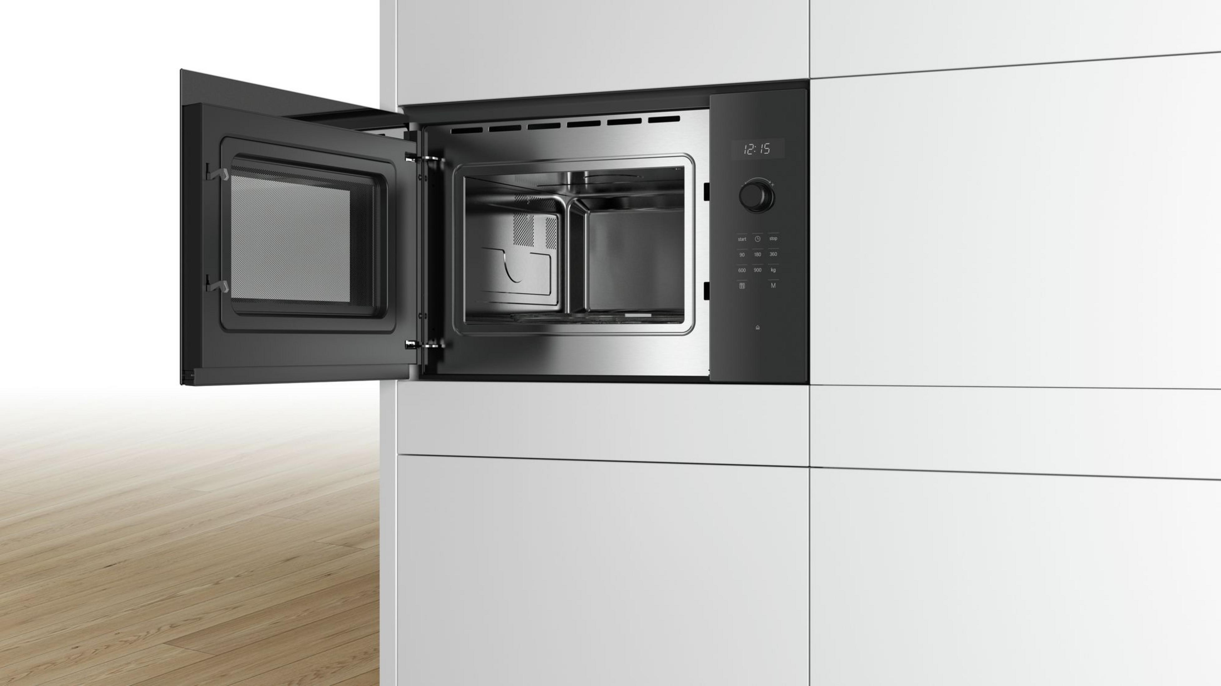 A modern built-in microwave oven with the door open, showing a stainless steel interior.