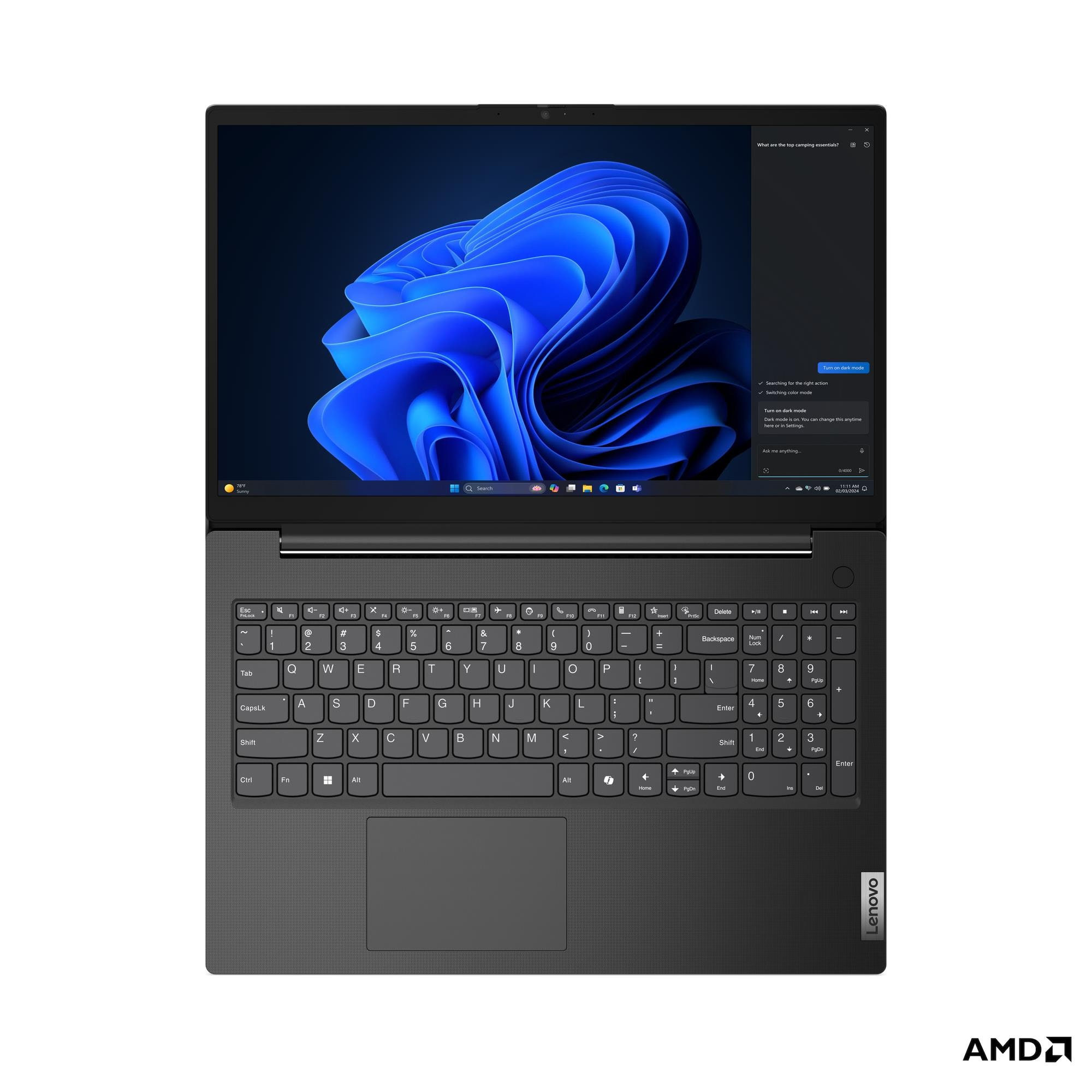 Un laptop chiuso con uno sfondo astratto scuro e una tastiera.