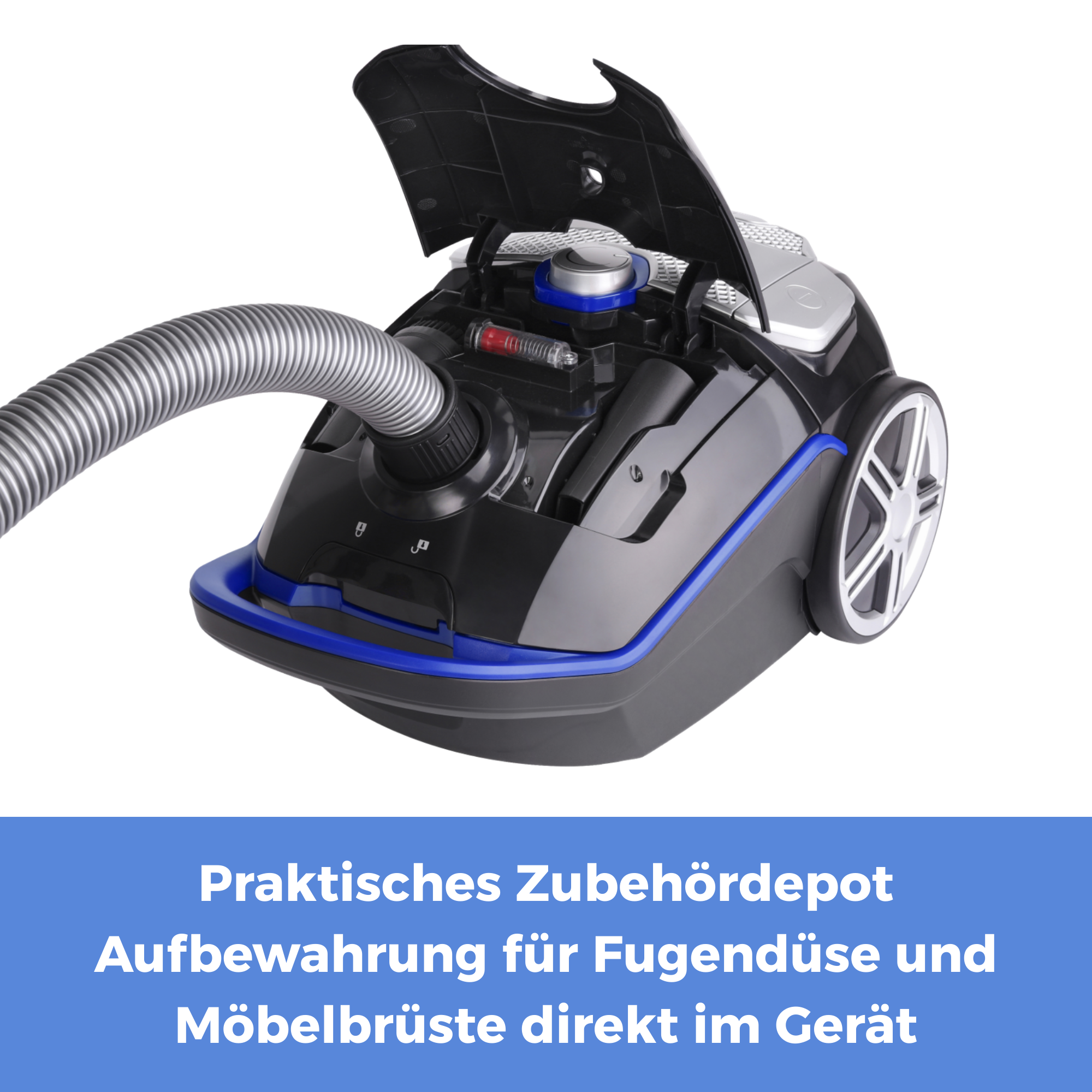 Schwarzer Staubsauger mit geöffnetem Deckel, Zubehör im Inneren, weißer Hintergrund.