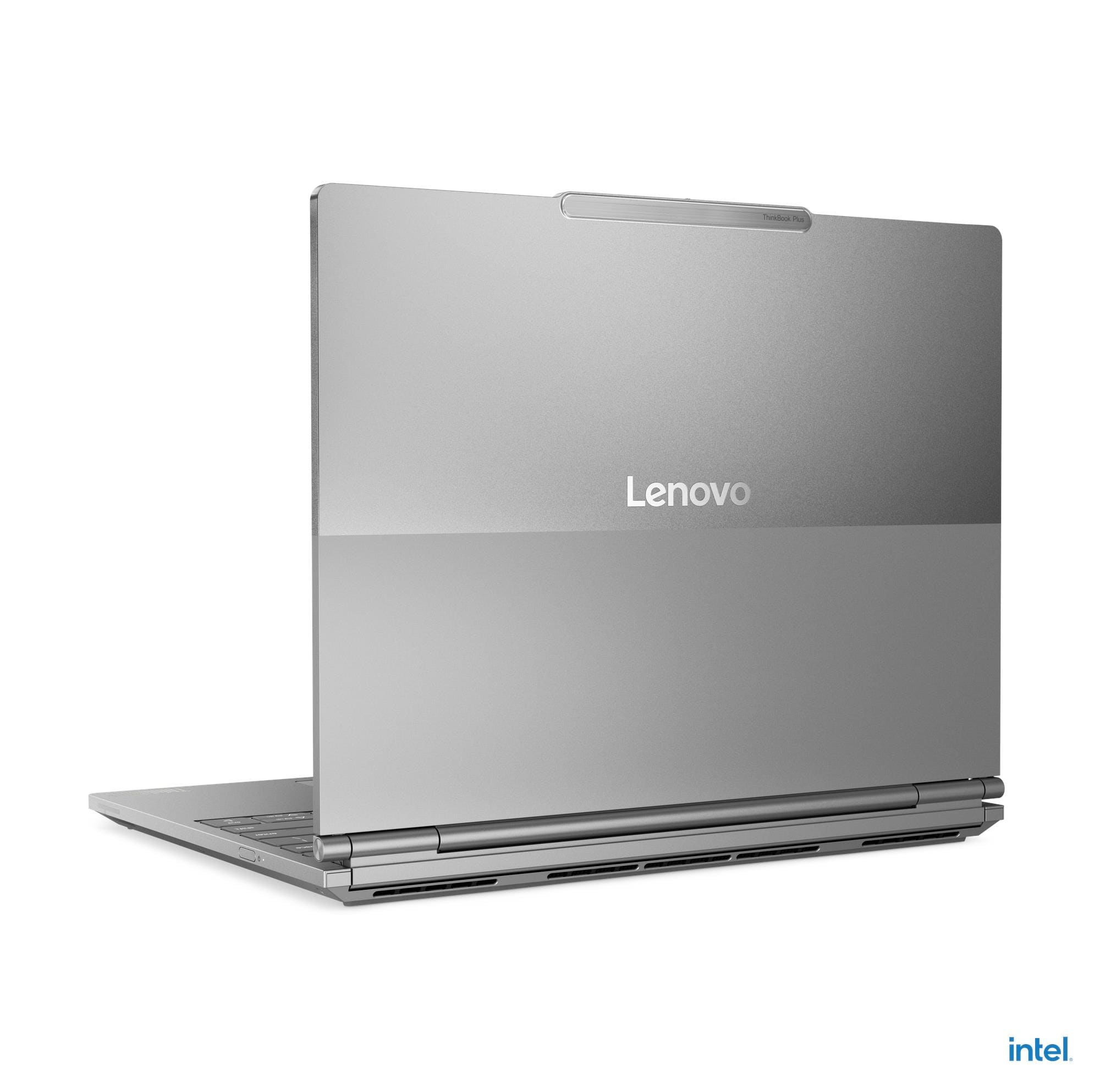 Un laptop Lenovo argentato è posizionato su una superficie bianca.