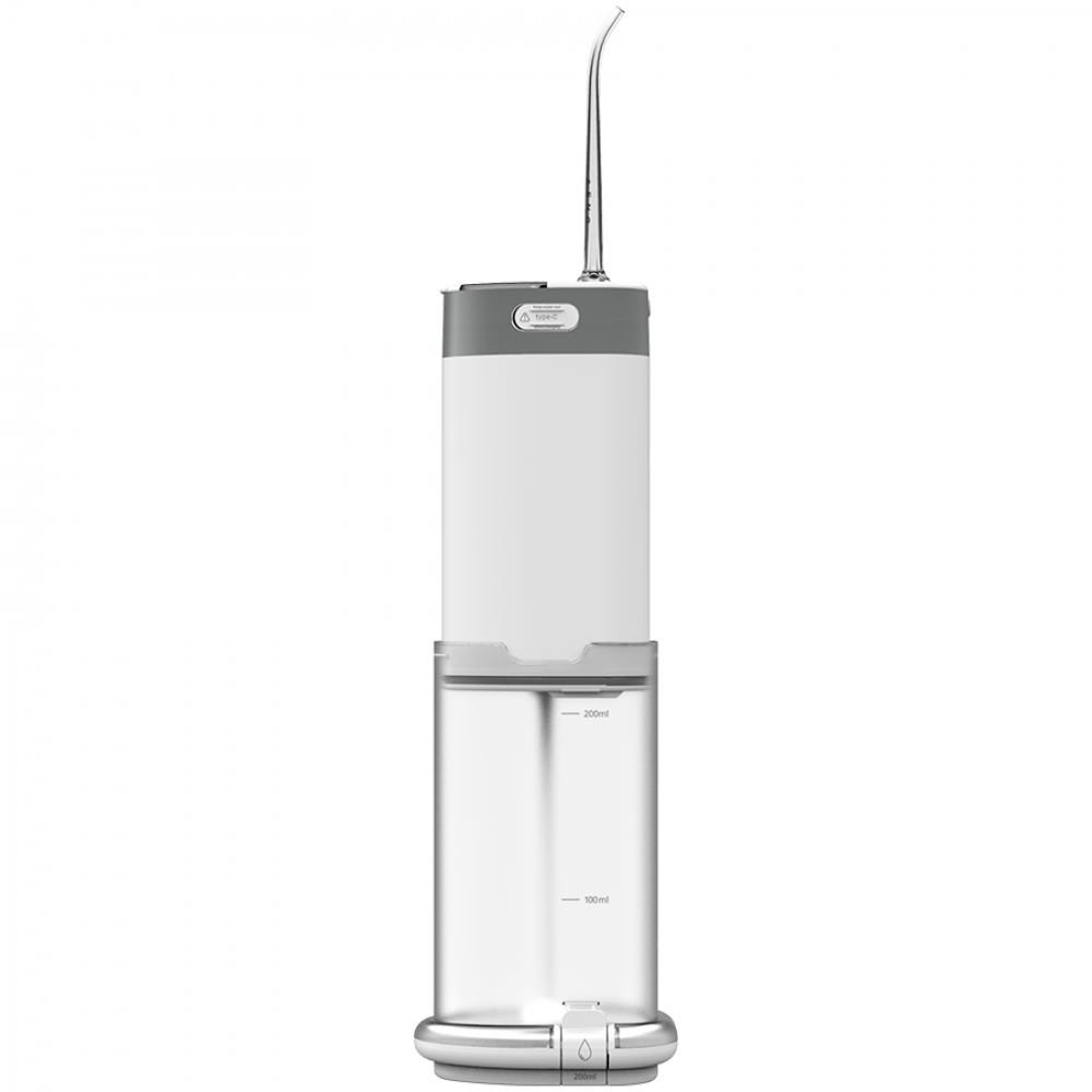Een wit en grijs draagbaar waterflosser met transparante basis met markeringen van 200 ml.
