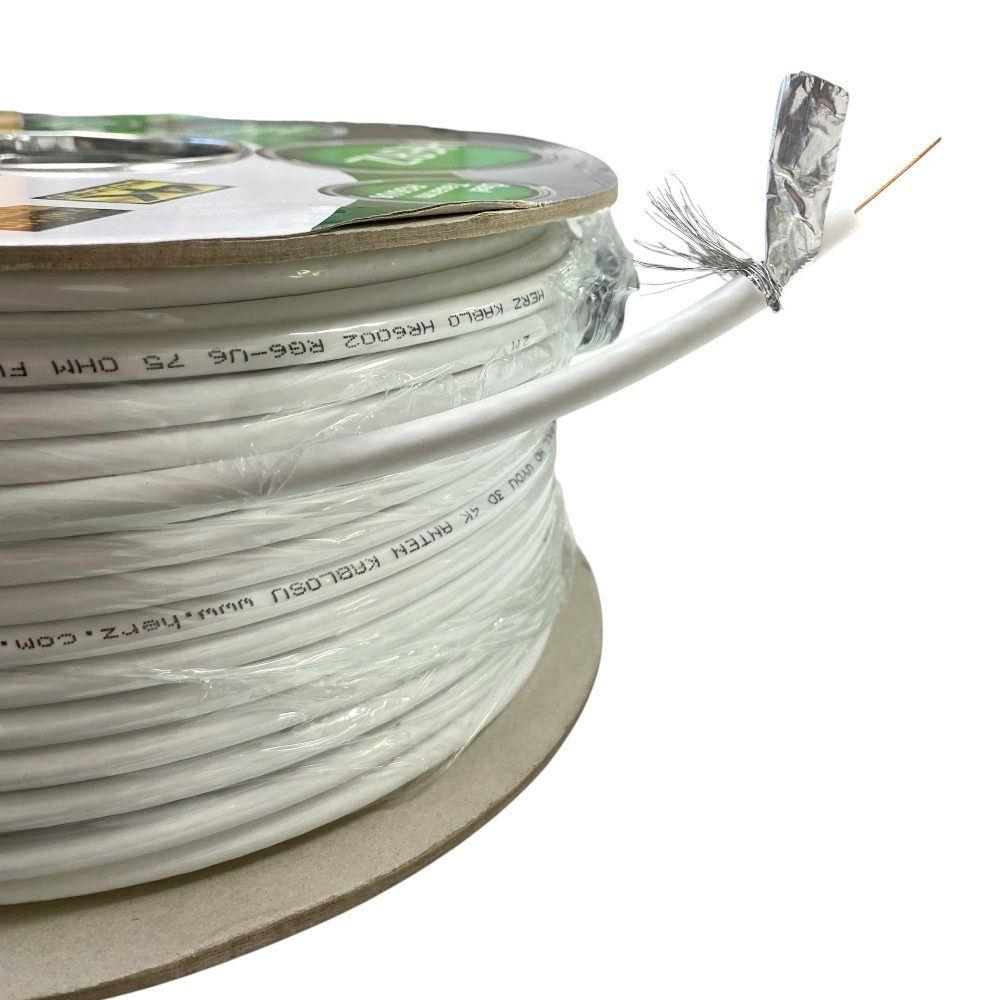 Üzerinde "HERZ KABLO HR6002 RG6-06 75 OHM FI" yazılı beyaz koaksiyel kablo makarası.