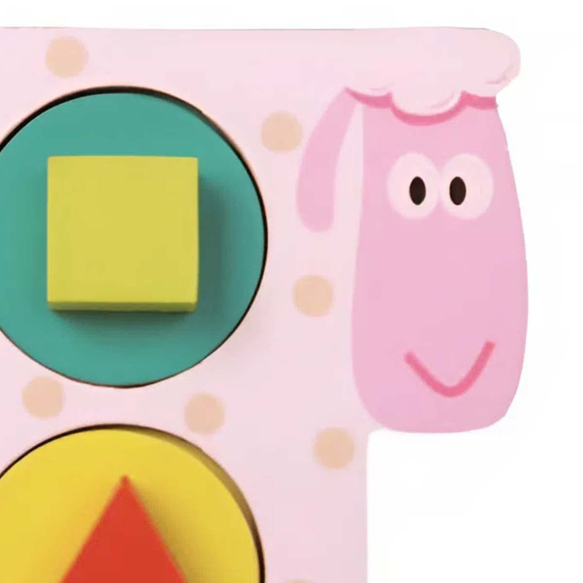 Un giocattolo pecora rosa con uno slot circolare verde e quadrato giallo. Visibili altre forme.
