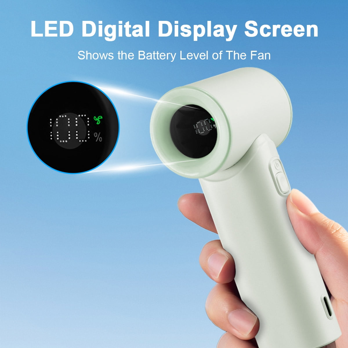 Eine Hand hält einen hellgrünen Ventilator mit einem digitalen Display, das 100% anzeigt.