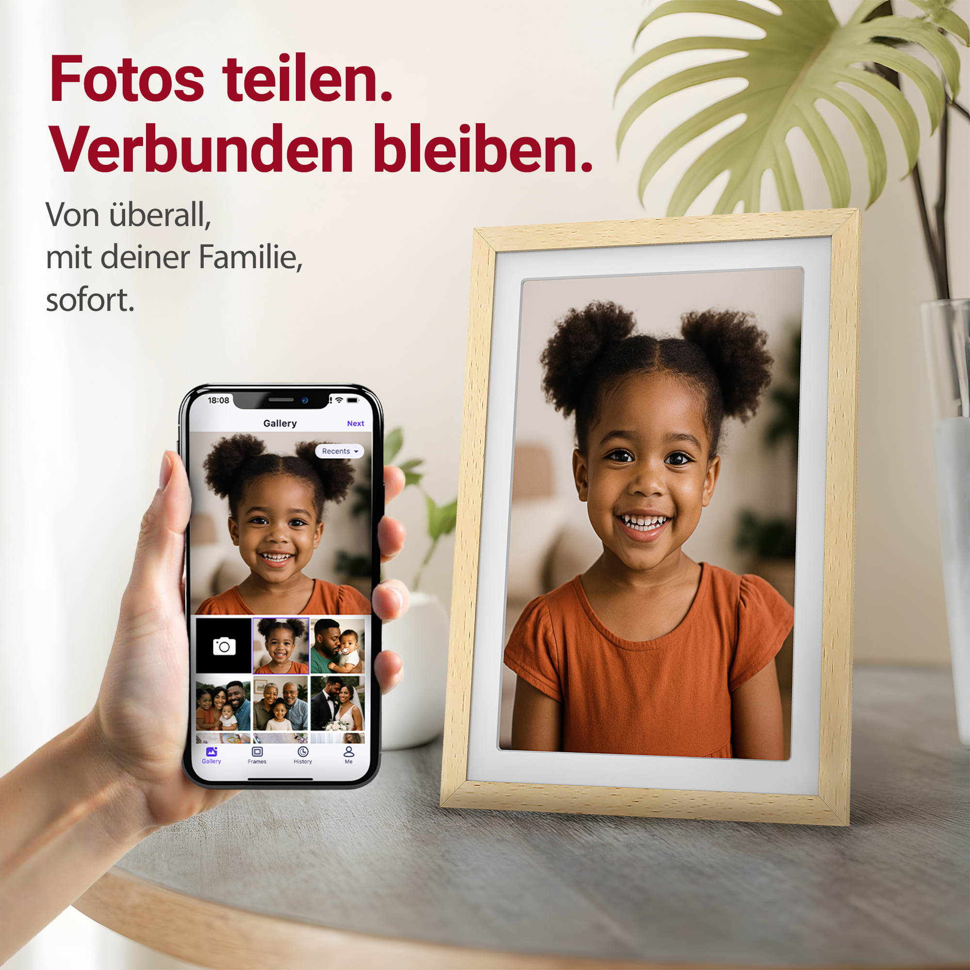Ein Handy zeigt ein Mädchen, daneben ein Bilderrahmen mit demselben Kind.