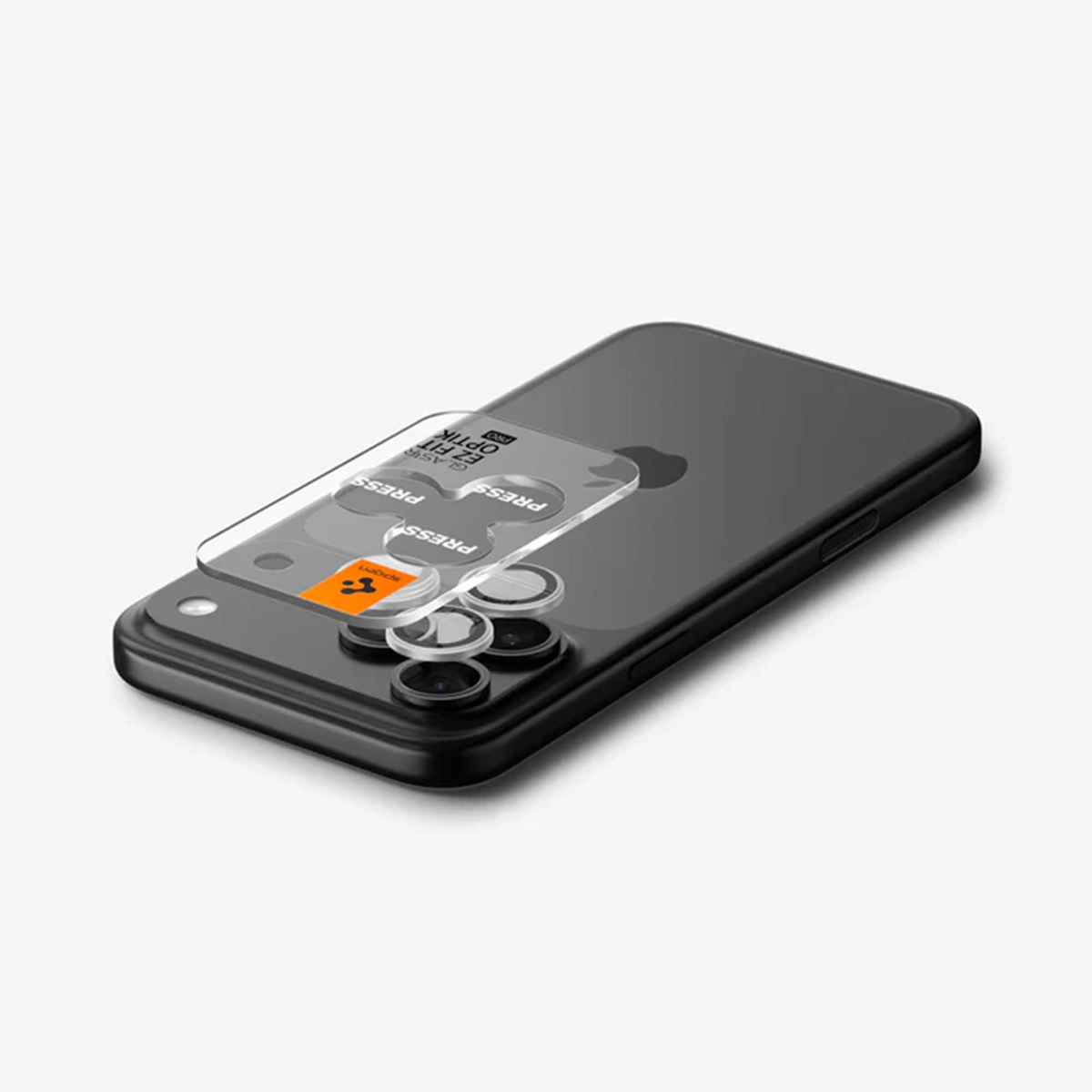 A black iPhone back with a clear tool for installing lens protectors.
