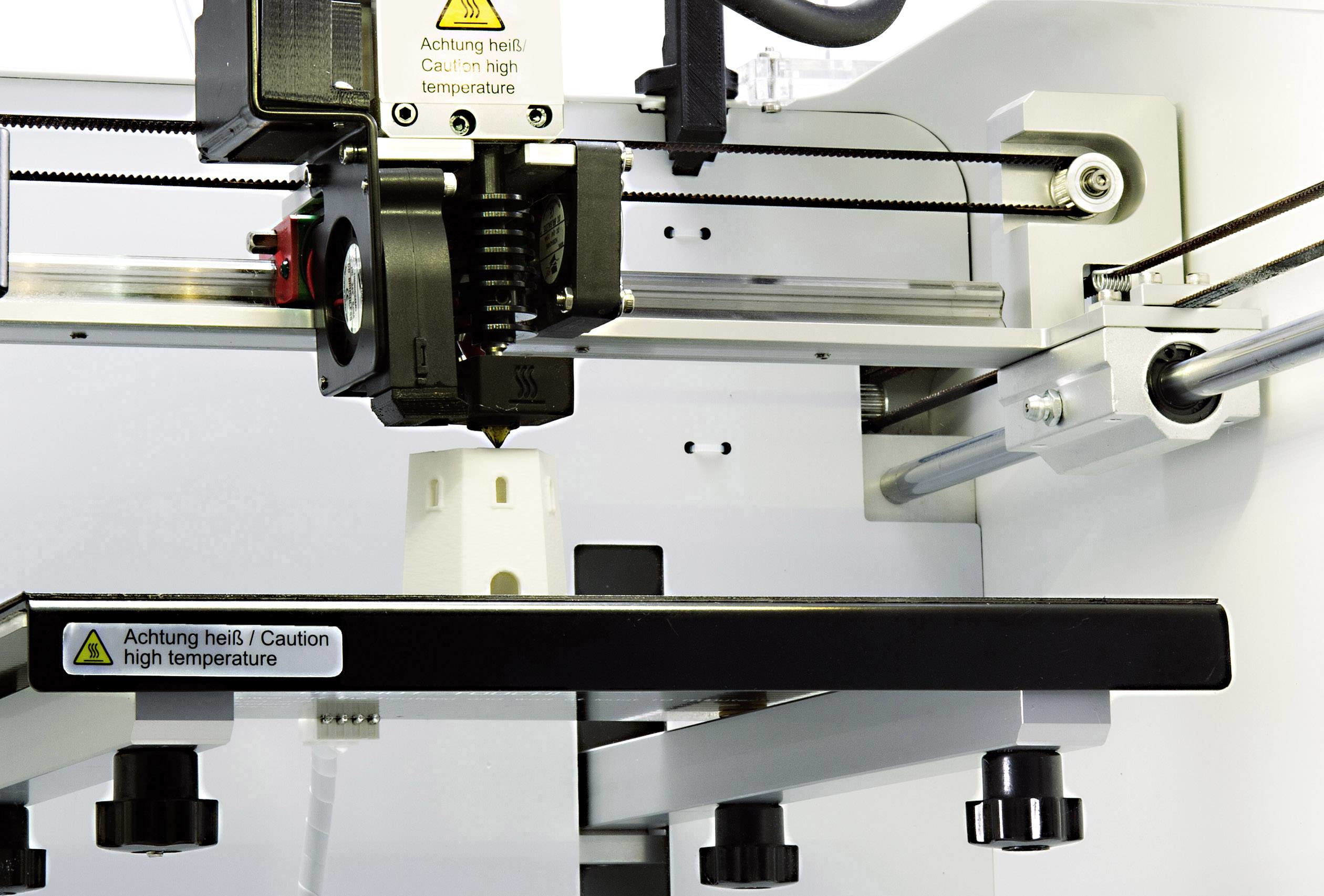 3D-Drucker druckt ein weißes Leuchtturmmodell mit Zahnriemenantrieb.
