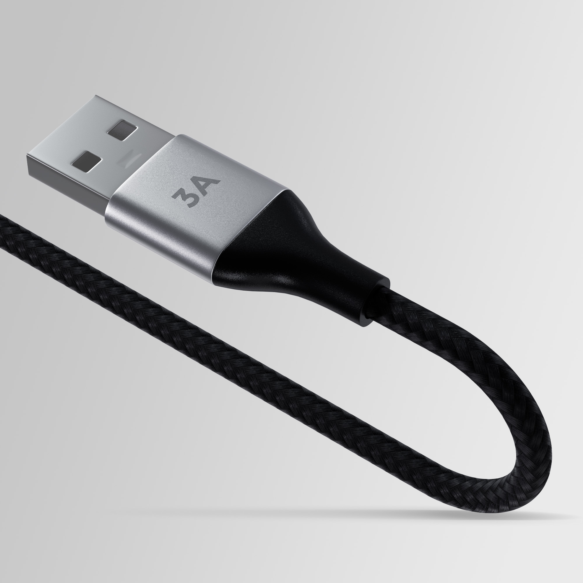 Un connettore USB argentato con etichetta 3A su un cavo intrecciato nero.