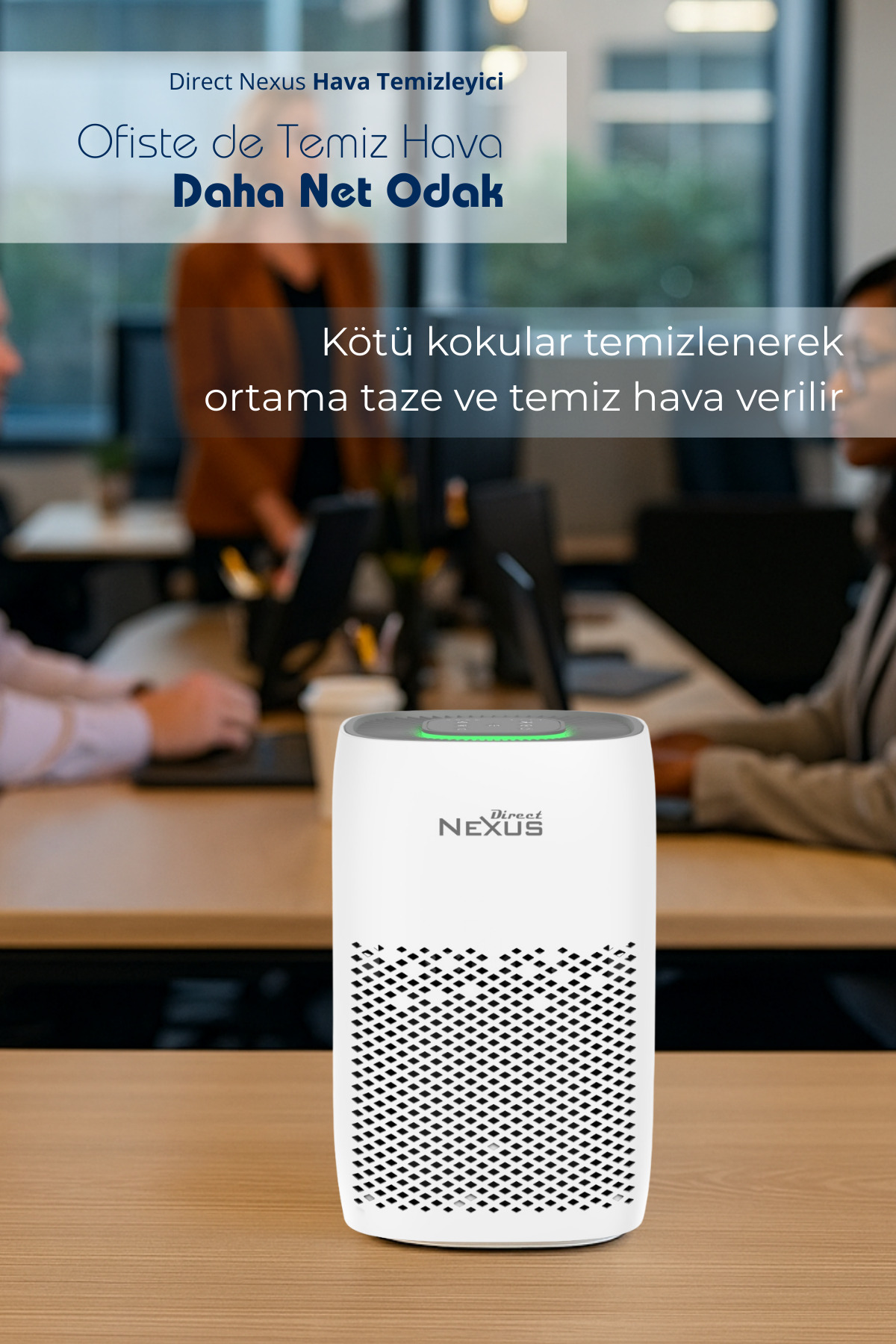 Direct Nexus logosuna sahip beyaz bir hava temizleyici, ofisteki ahşap masada duruyor.
