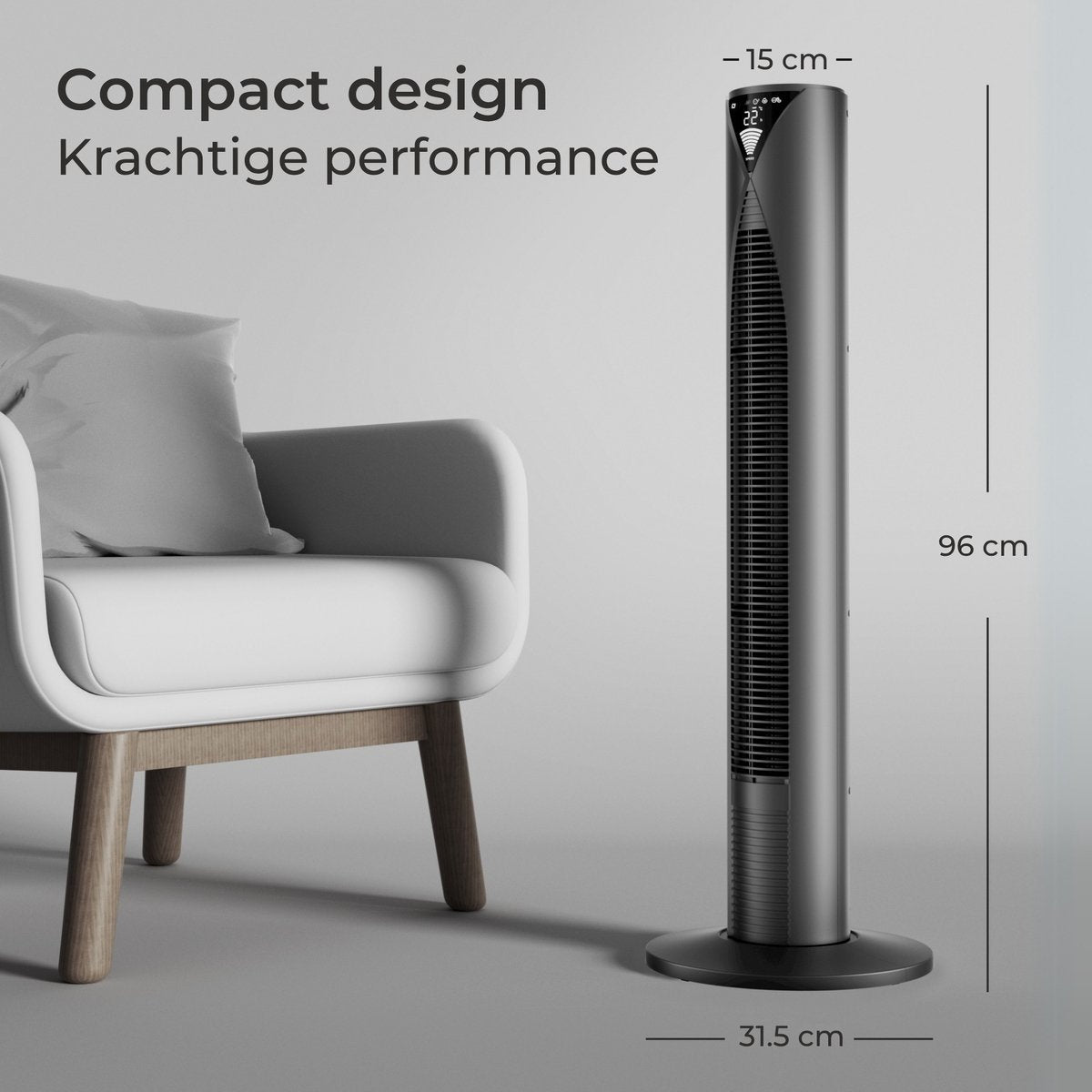 Zwarte torenventilator naast een witte fauteuil. Afmetingen: 96cm hoog, 15cm breed.