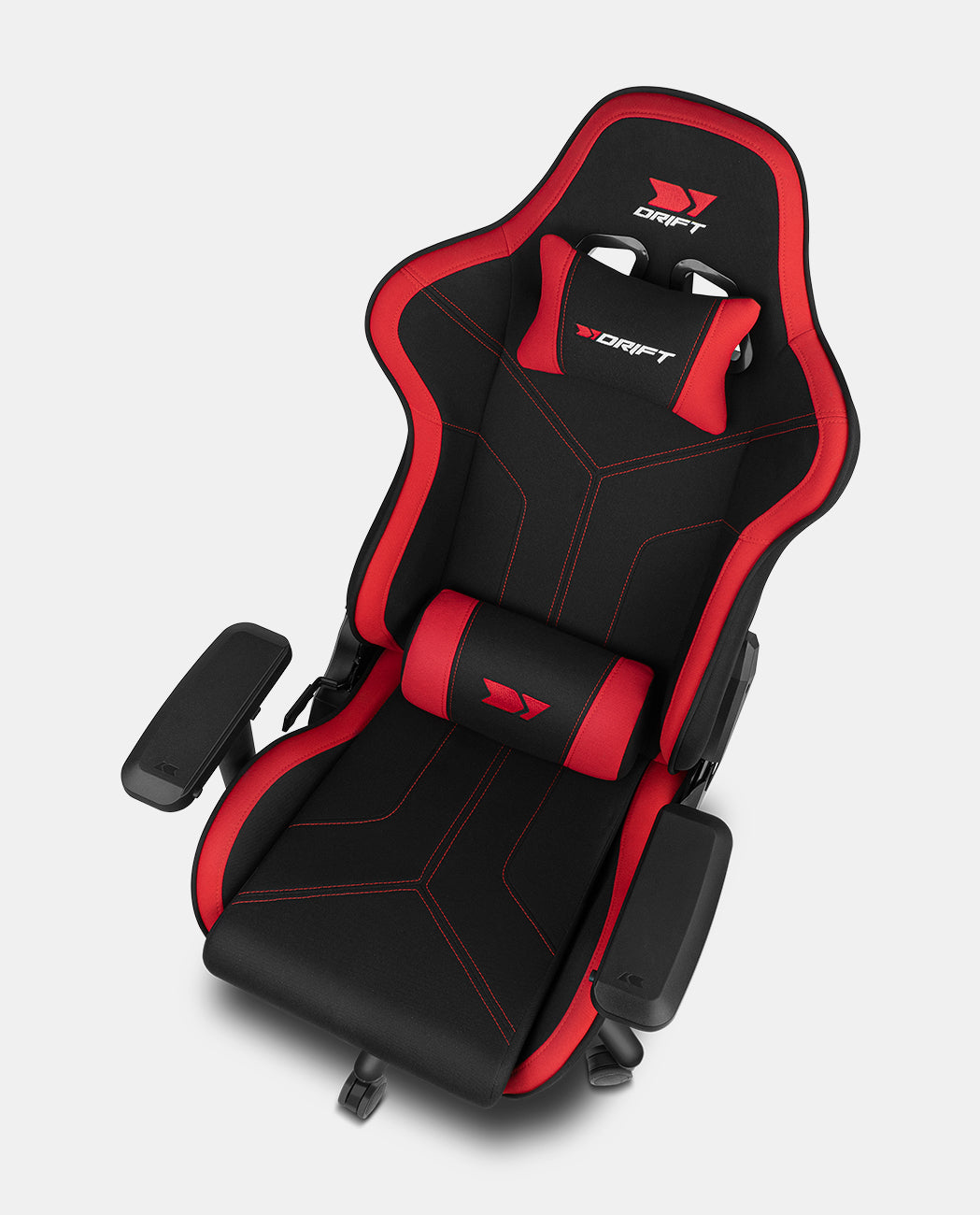 Una sedia da gaming nera e rossa con cuscini per collo e schiena.