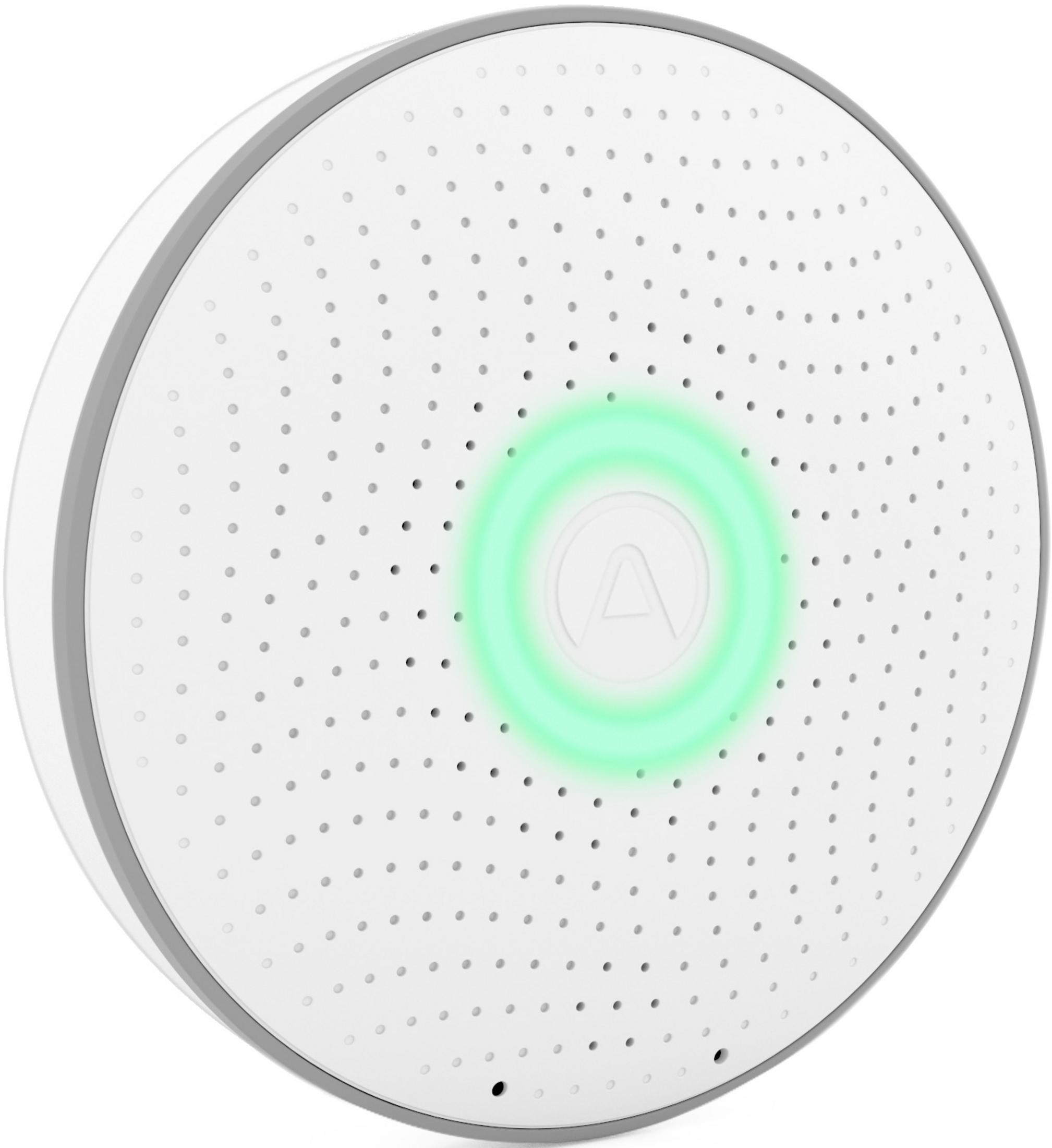 Ein weißer runder Diffusor mit grauer Umrandung und grüner Lichterkennung.