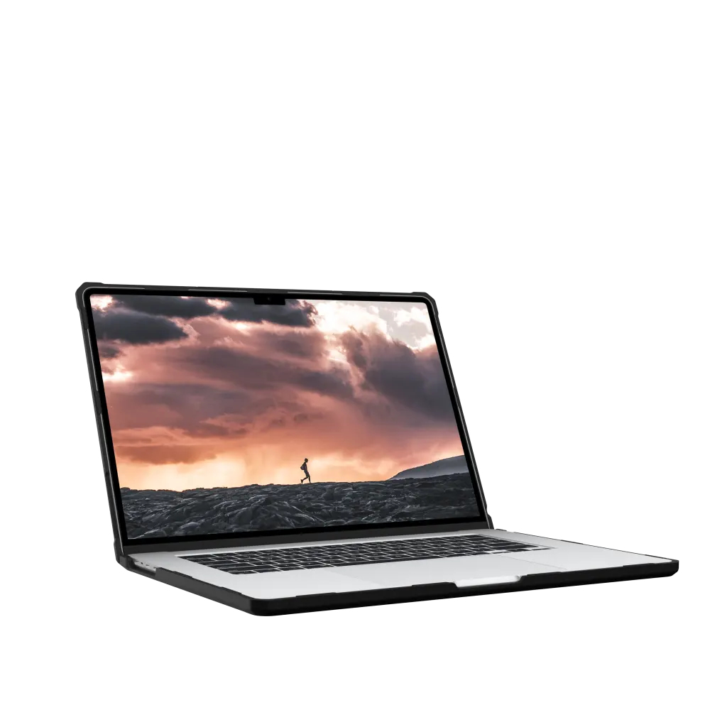 Laptop w etui, na ekranie którego widać biegacza o zachodzie słońca.
