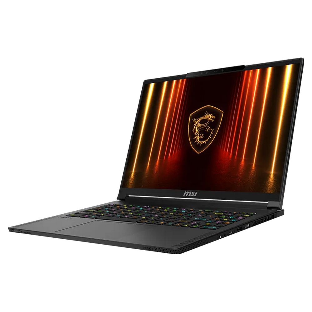 Un laptop MSI nero con logo drago luminoso sullo schermo e tastiera colorata.