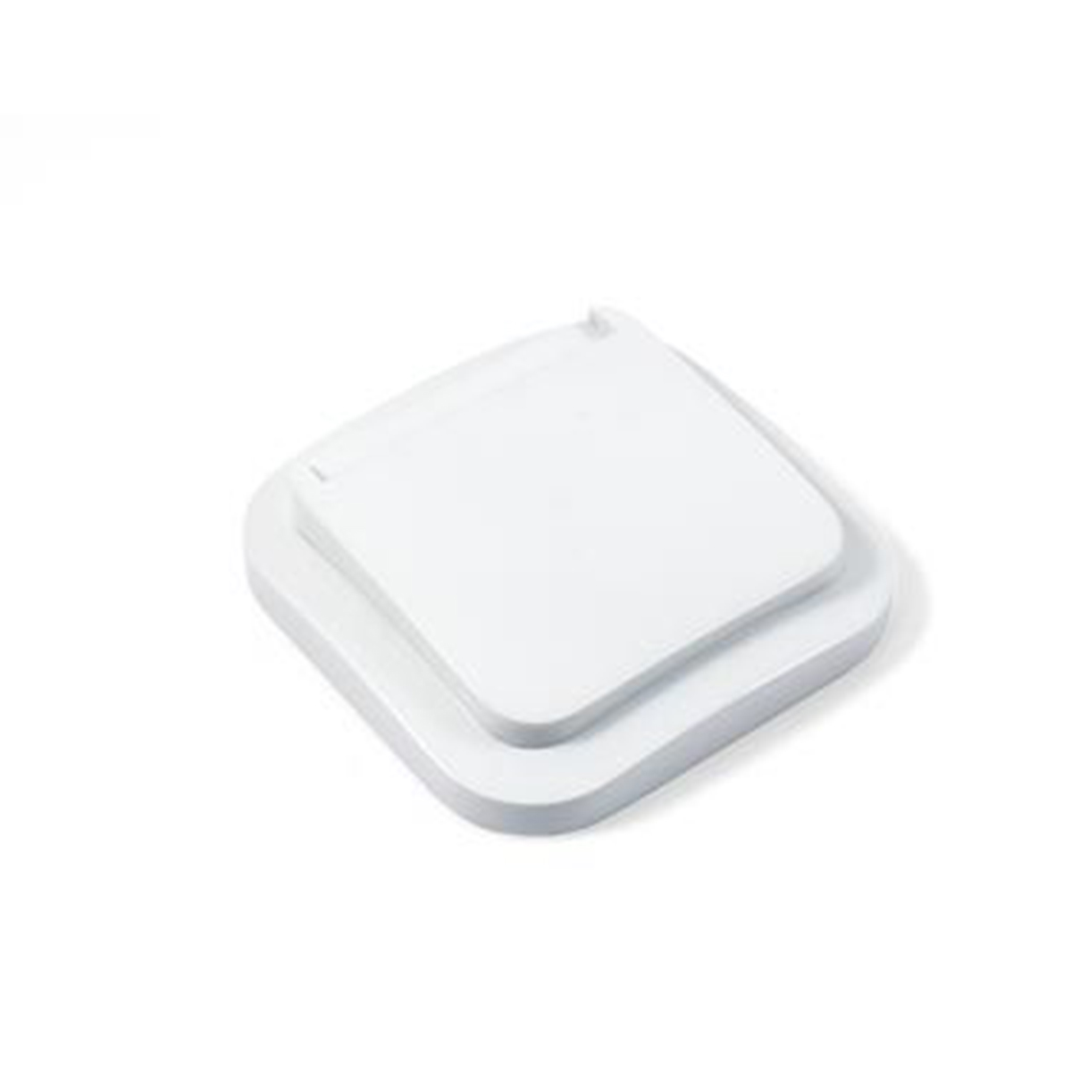 Un coperchio bianco e quadrato appoggiato su una base.