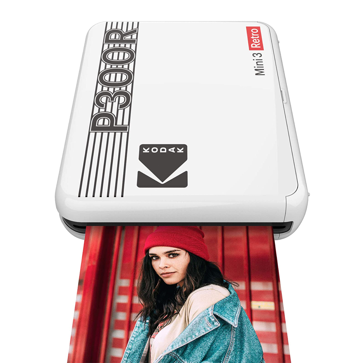 Ein weißer Kodak Mini 3 Retro Drucker mit einem Foto einer Frau in roter Mütze.