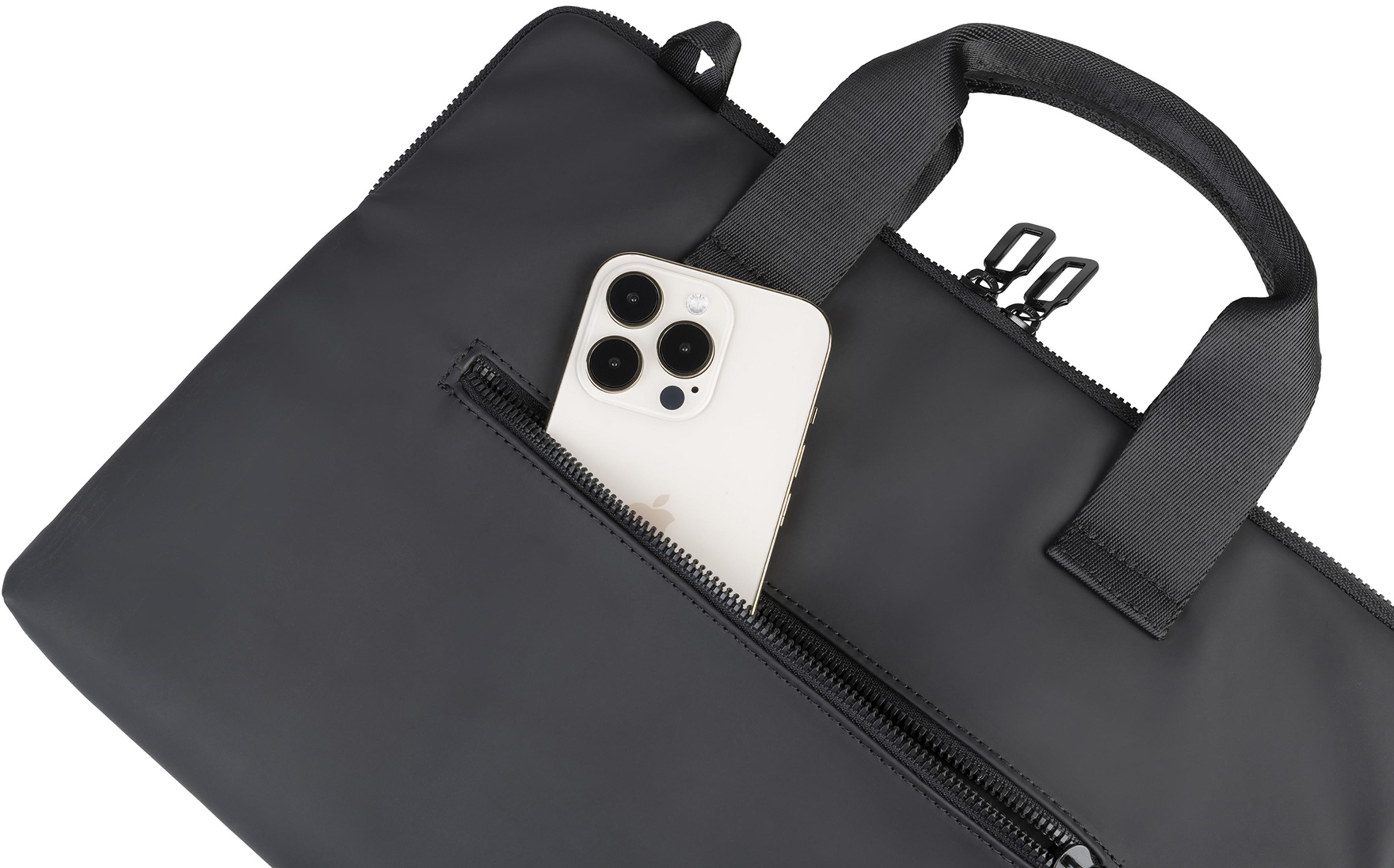 Uno smartphone bianco è nella tasca con cerniera di una borsa nera.