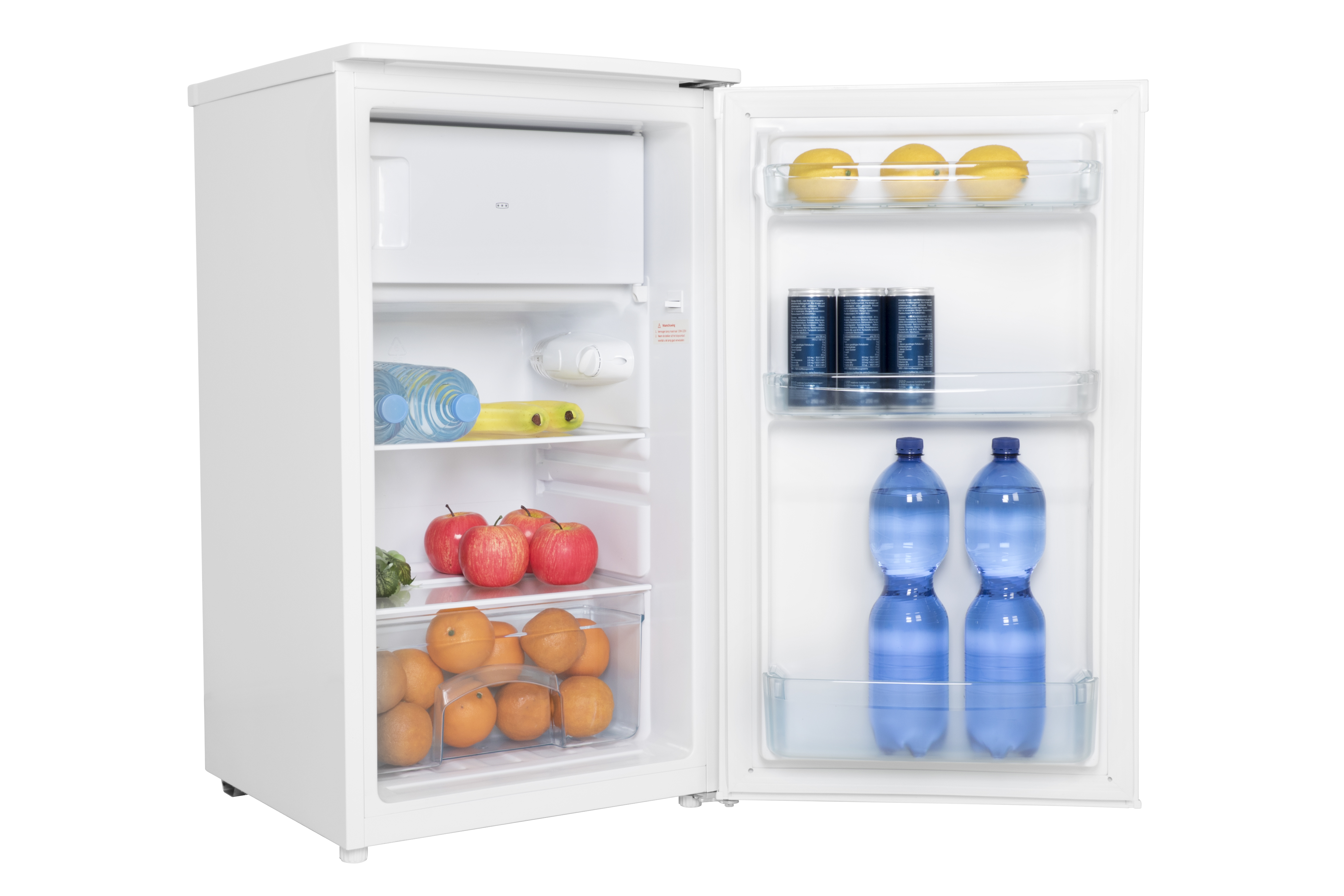 An open white refrigerator stocked with lemons, cans, water bottles, apples, and oranges.