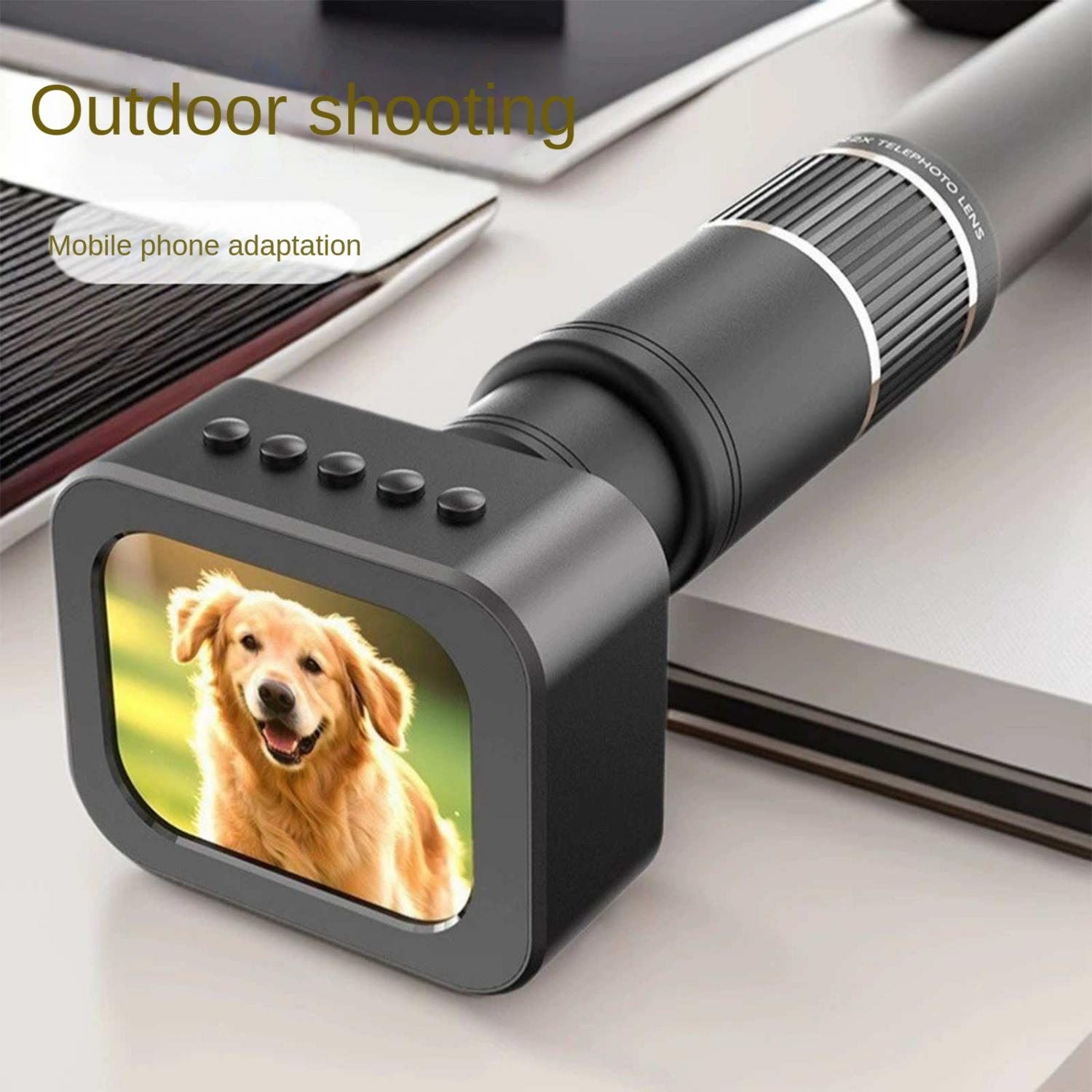 Ein golden Retriever lacht auf einem kleinen Bildschirm, der an einem Teleobjektiv befestigt ist.
