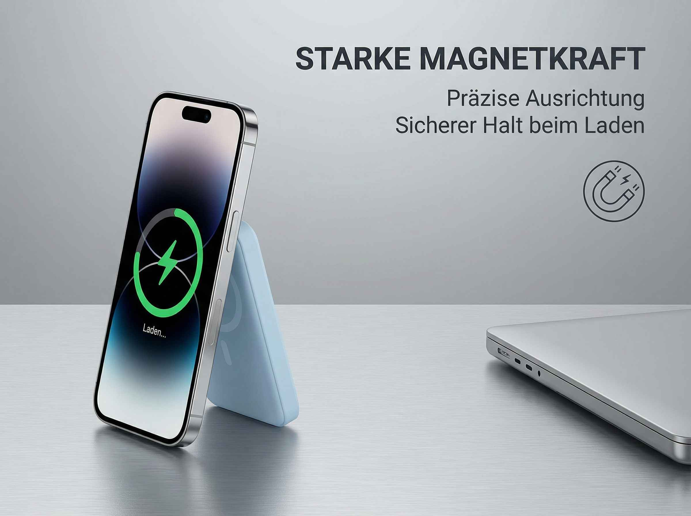 Ein iPhone lädt auf einem blauen Ständer neben einem Laptop. Starker Magnetismus.