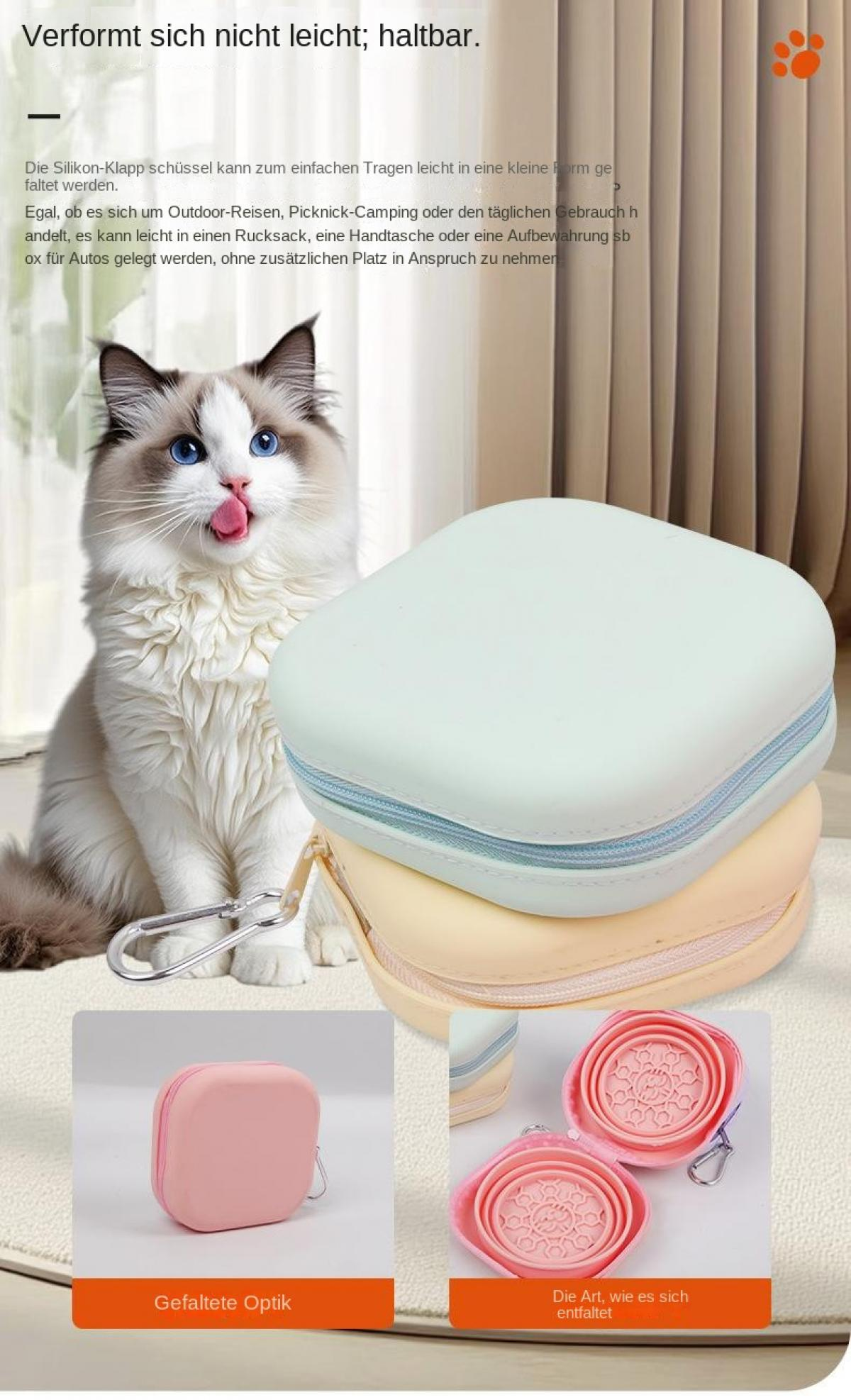 Eine Katze mit blauen Augen und rosa Zunge sitzt neben faltbaren Schüsseln.