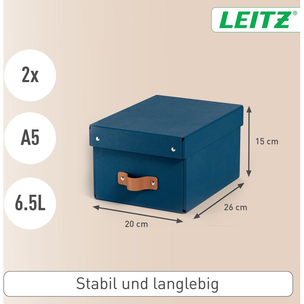 Eine dunkelblaue Aufbewahrungsbox mit Ledergriff, 26x20x15cm.