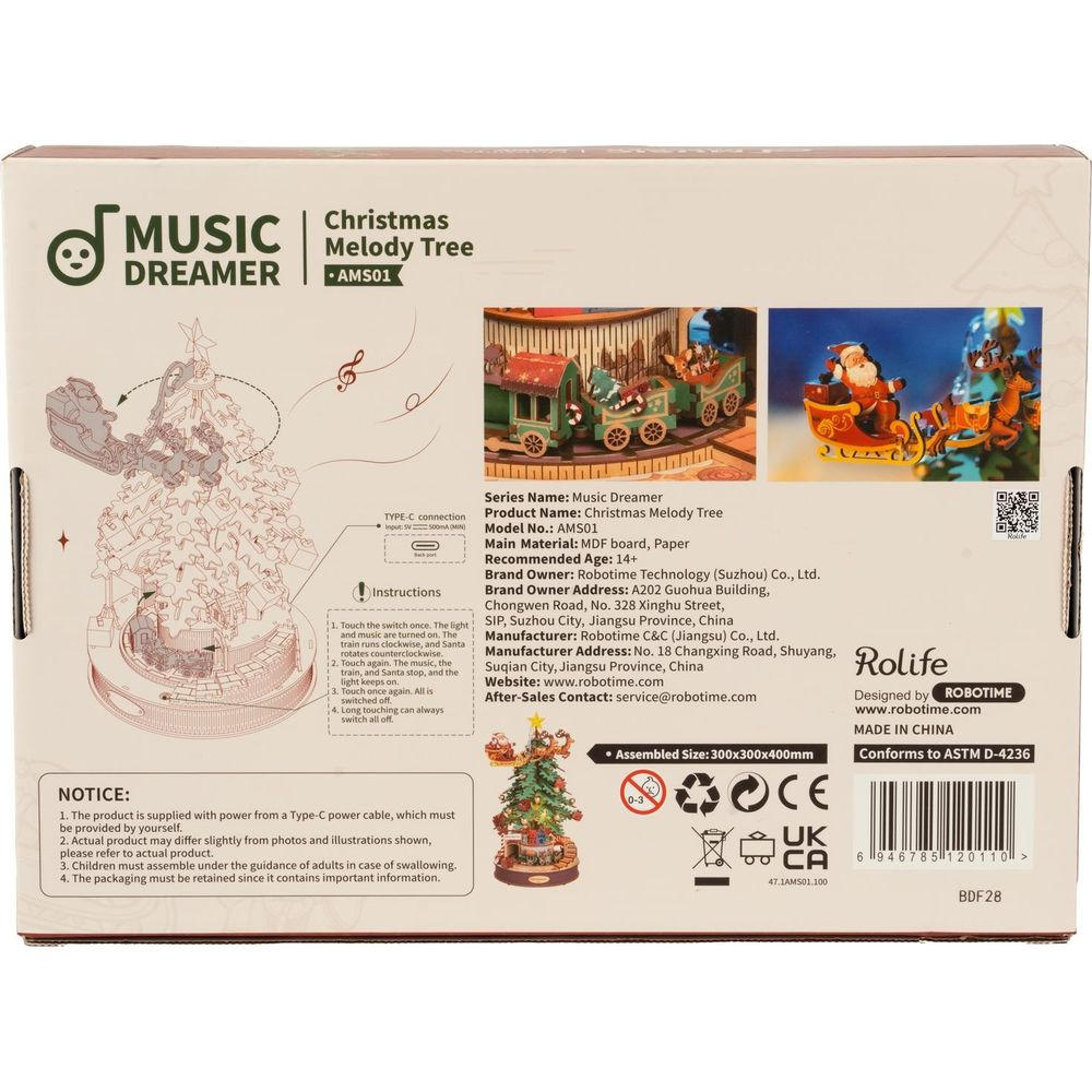 Verpackung eines Weihnachtsbaum-Musikalisches Spielzeugs mit Zug und Weihnachtsmann.