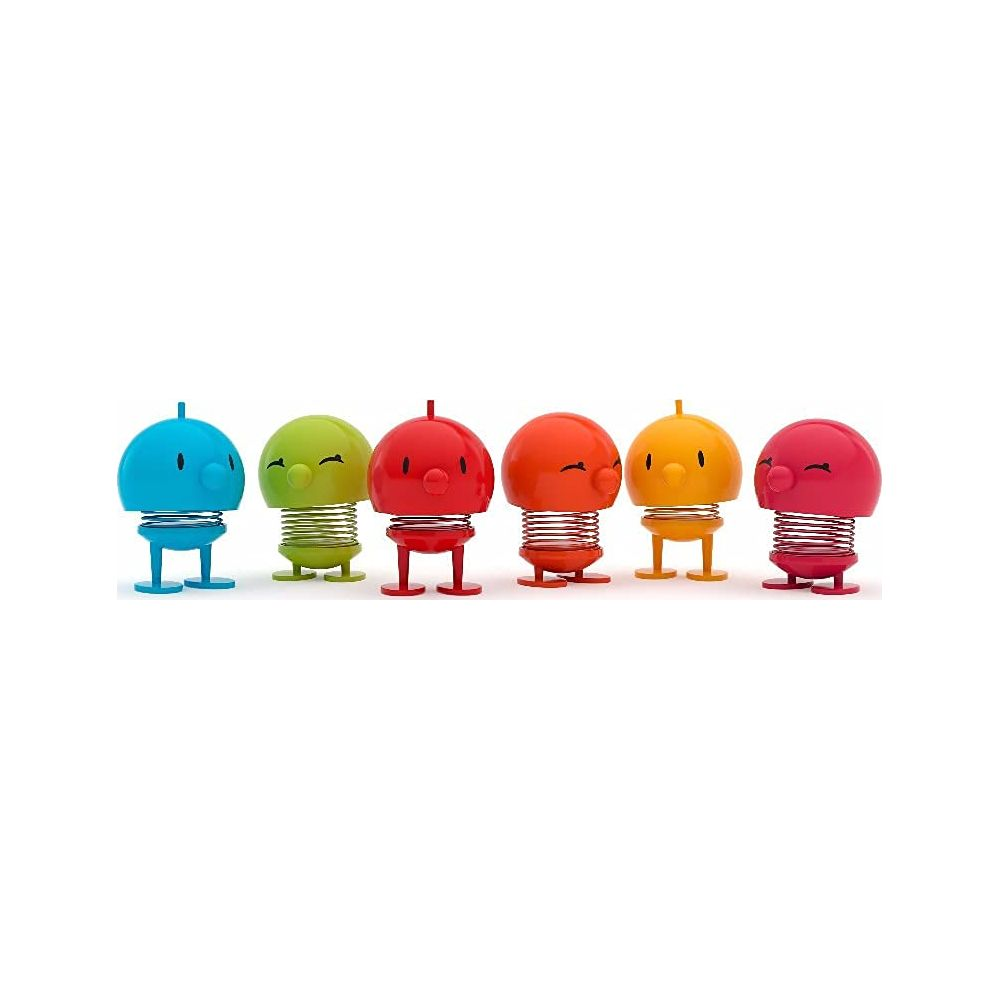 Cinque giocattoli a molla colorati: blu, verde, rosso, arancione e giallo.