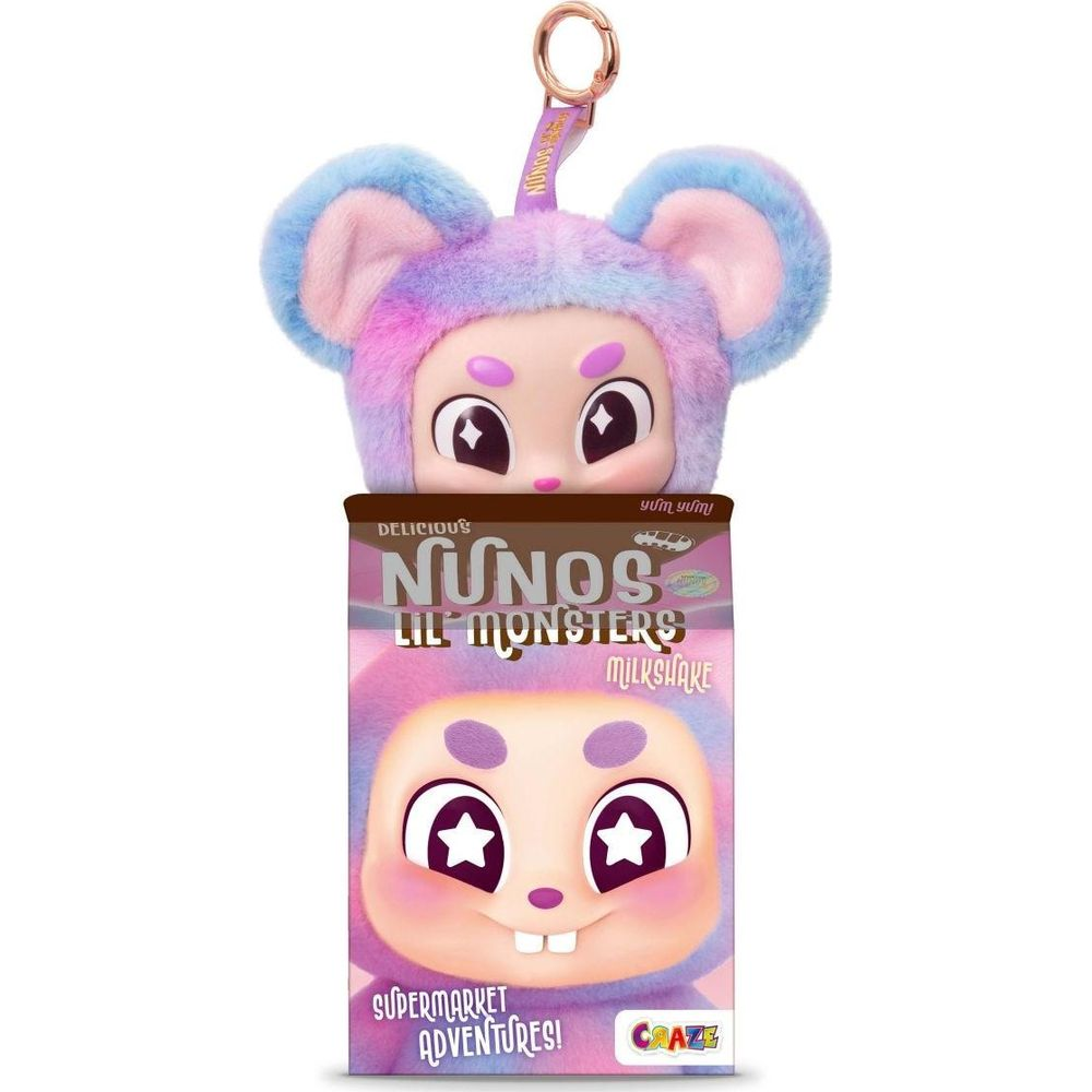 Un giocattolo viola e soffice con orecchie blu spunta da una scatola di milkshake Nunos Lil Monsters.