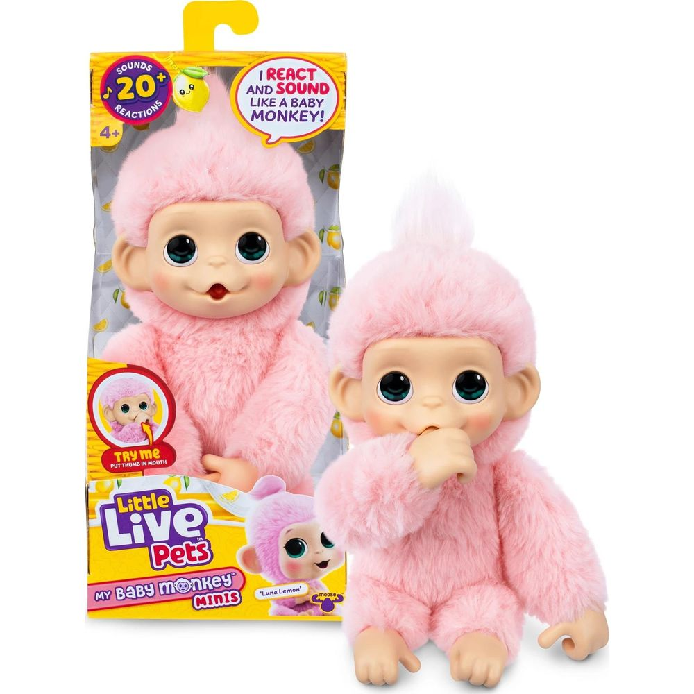 Un juguete de mono de peluche rosa con ojos grandes, chupándose el pulgar.