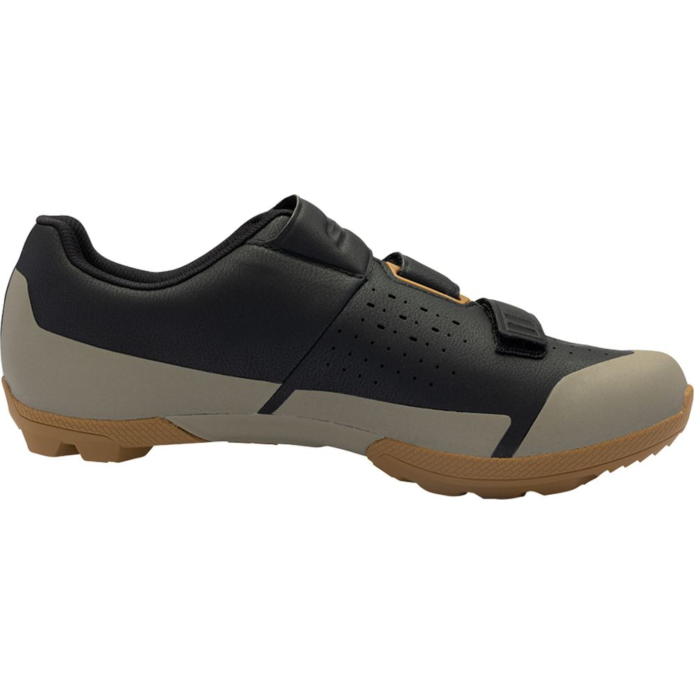 Schwarzer Radschuh mit beigefarbenen Akzenten und Klettverschluss.