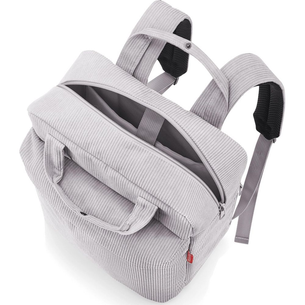 Grauer Cord-Rucksack mit offenem Hauptfach und Tragegriffen.