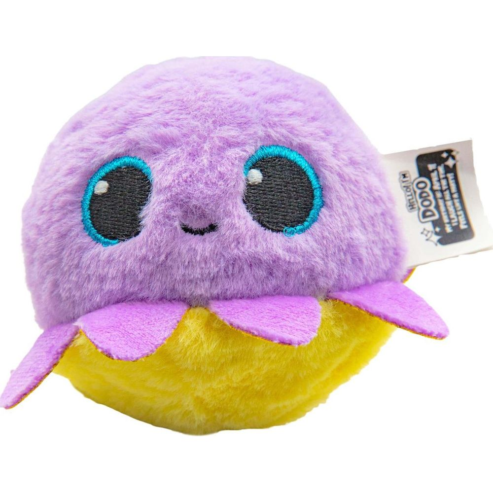 Ein flauschiges lila Wesen mit großen blauen Augen und gelbem Körper.