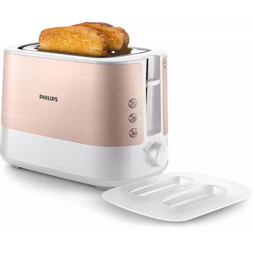 Gül altın rengi Philips tost makinesi, iki dilim kızarmış ekmek ve kırıntı tepsisi.