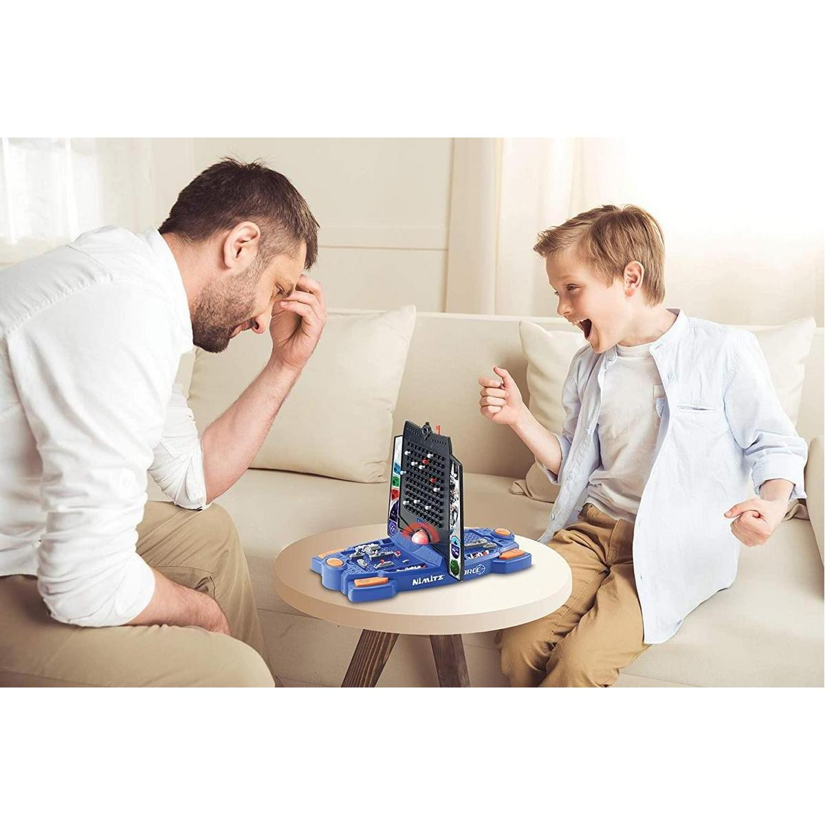 Hombre y niño jugando un juego de mesa en una mesa.
