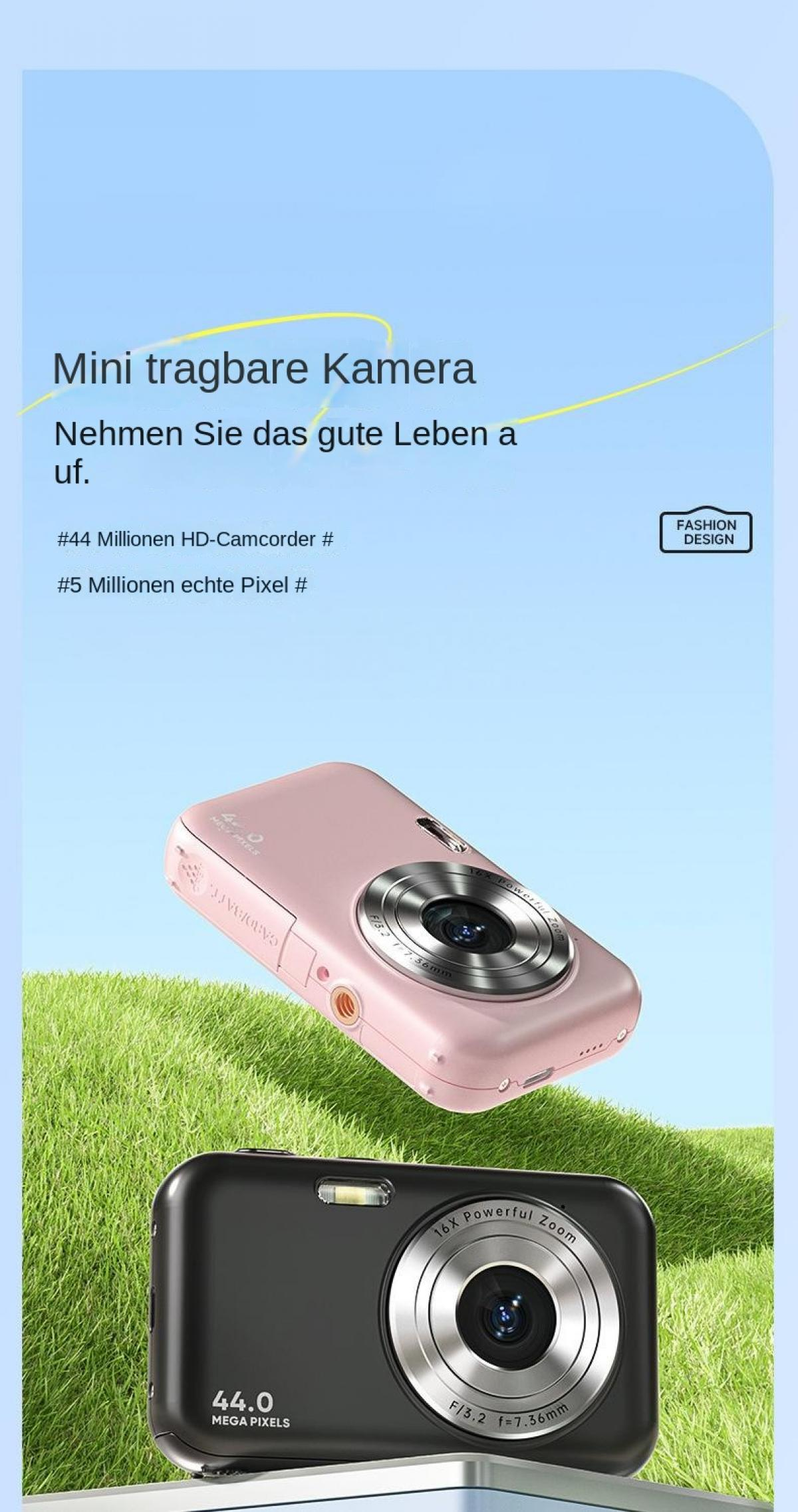 Zwei Digitalkameras, eine rosafarbene und eine schwarze, auf grünem Gras.