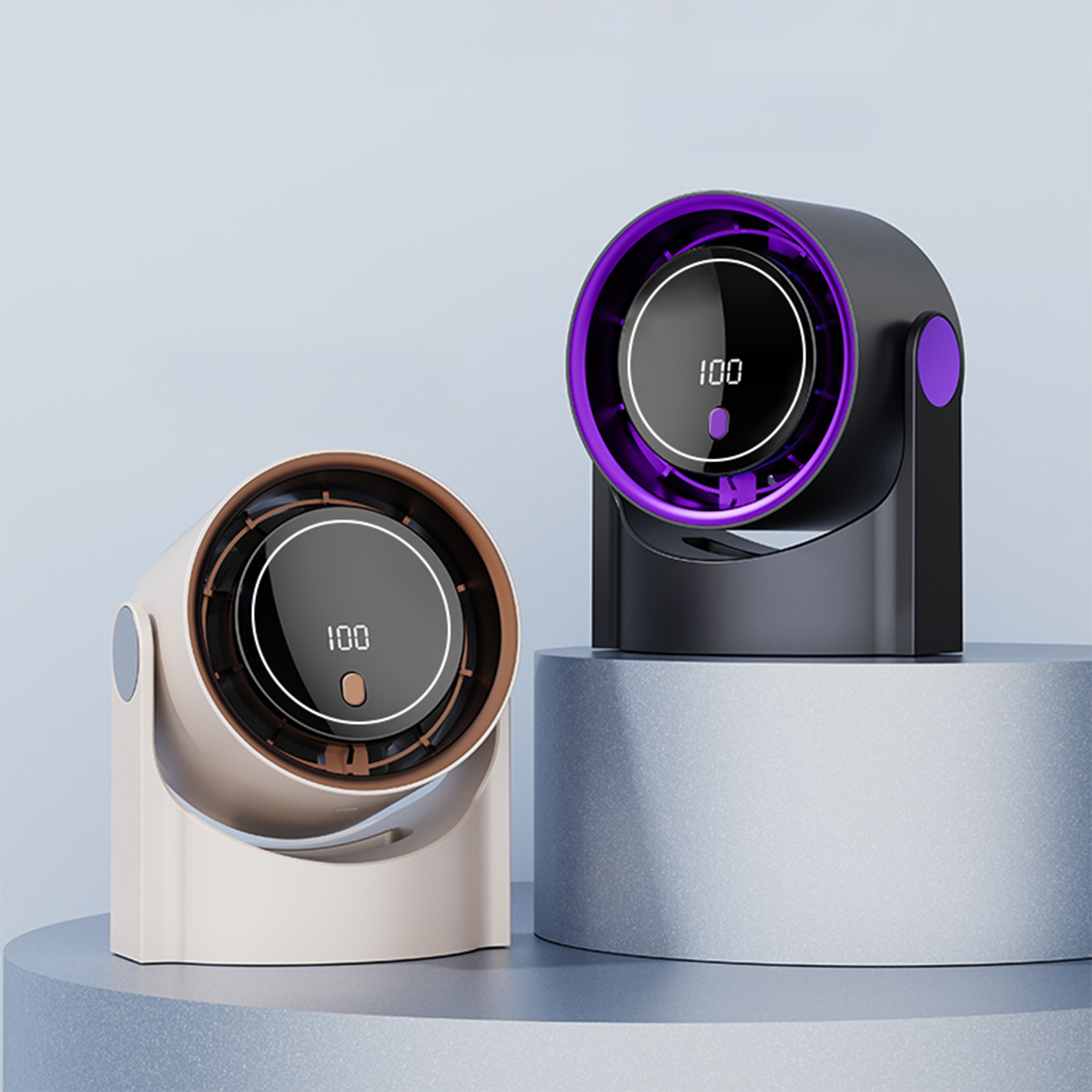 Due ventilatori: uno beige con bordo in rame, uno nero con cornice viola. Entrambi mostrano '100'.