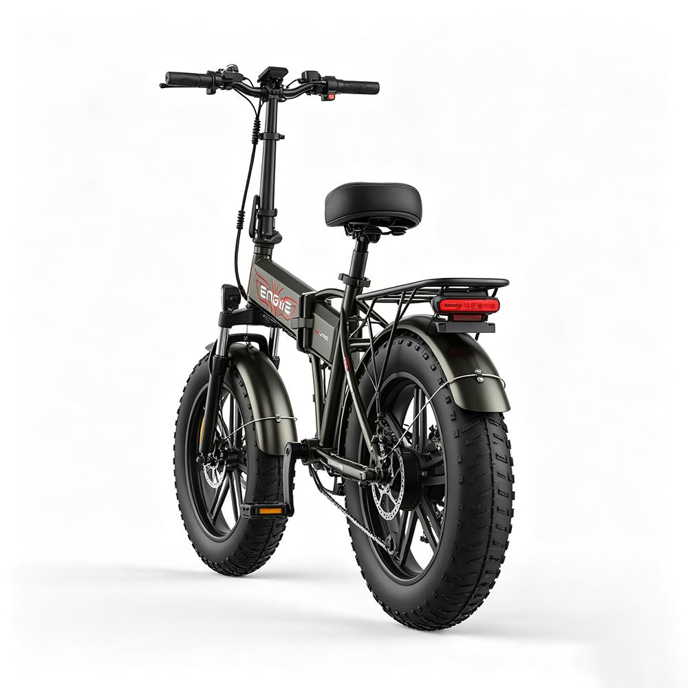 Ein schwarzes faltbares E-Bike mit fetten Reifen und Gepäckträger.
