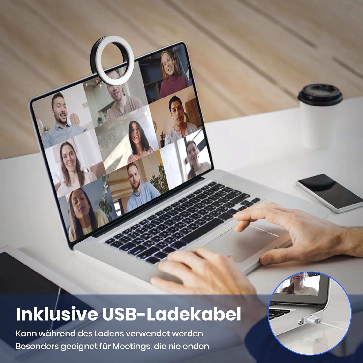Laptop mit Videokonferenz, Hände auf Tastatur, Tasse Kaffee, Handy.